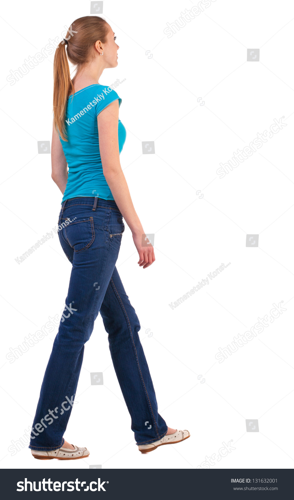 Back View Walking Woman In Jeans . Beautiful Blonde Girl In Motion ...