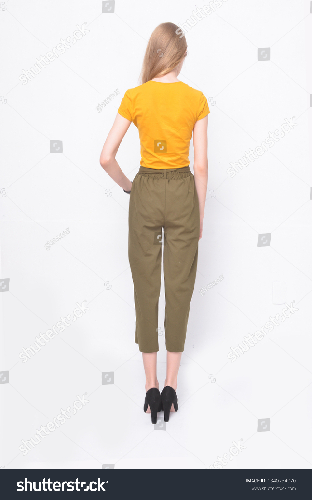 yellow shirt and brown pants