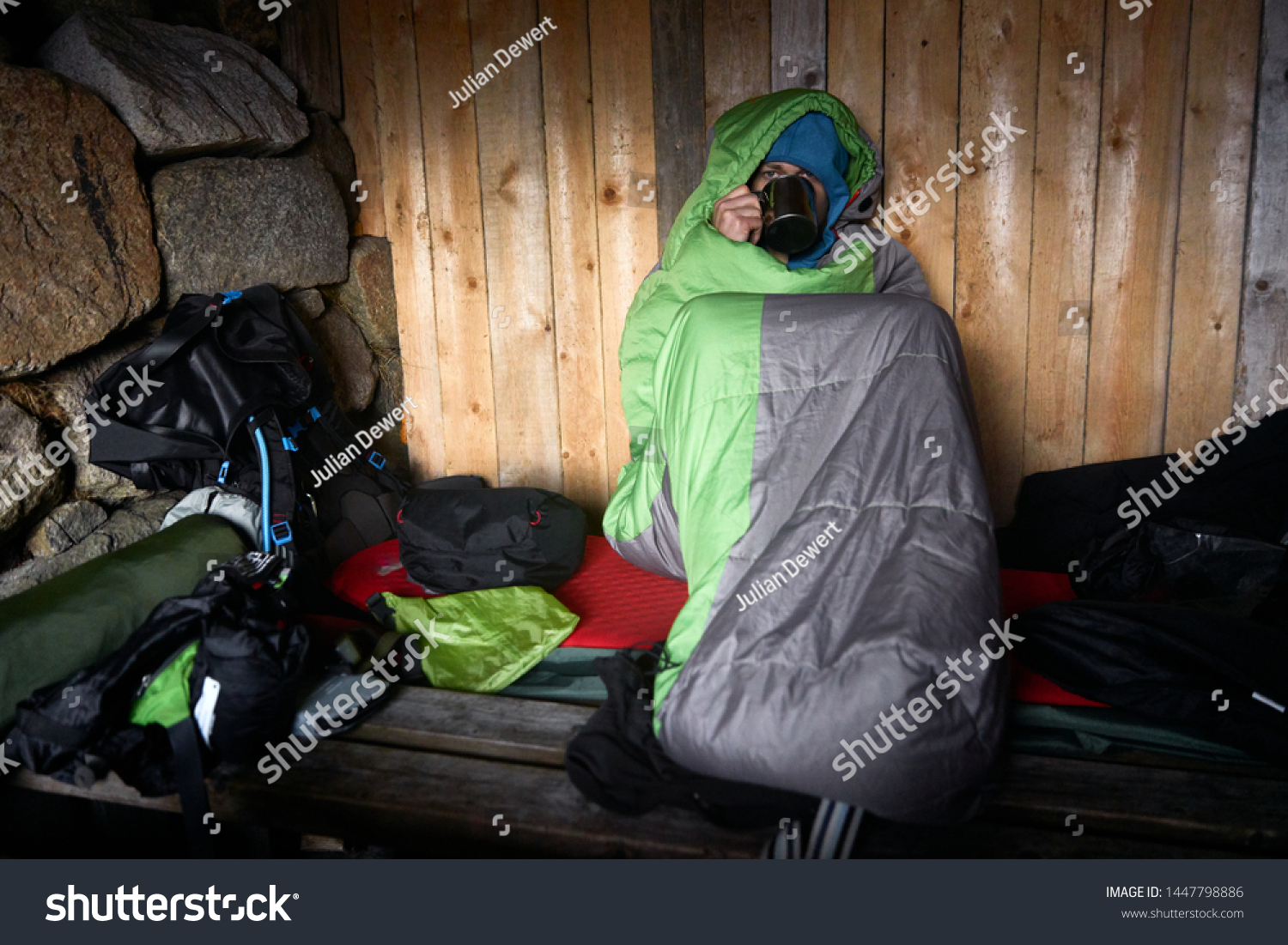 Backpacker Sitting His Sleeping Bag Wooden Stock Photo Edit Now