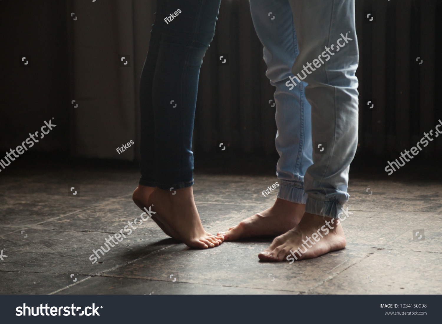 Стоковая фотография 1034150998 Barefoot Girl Standing On Tiptoe Hug Shutterstock 