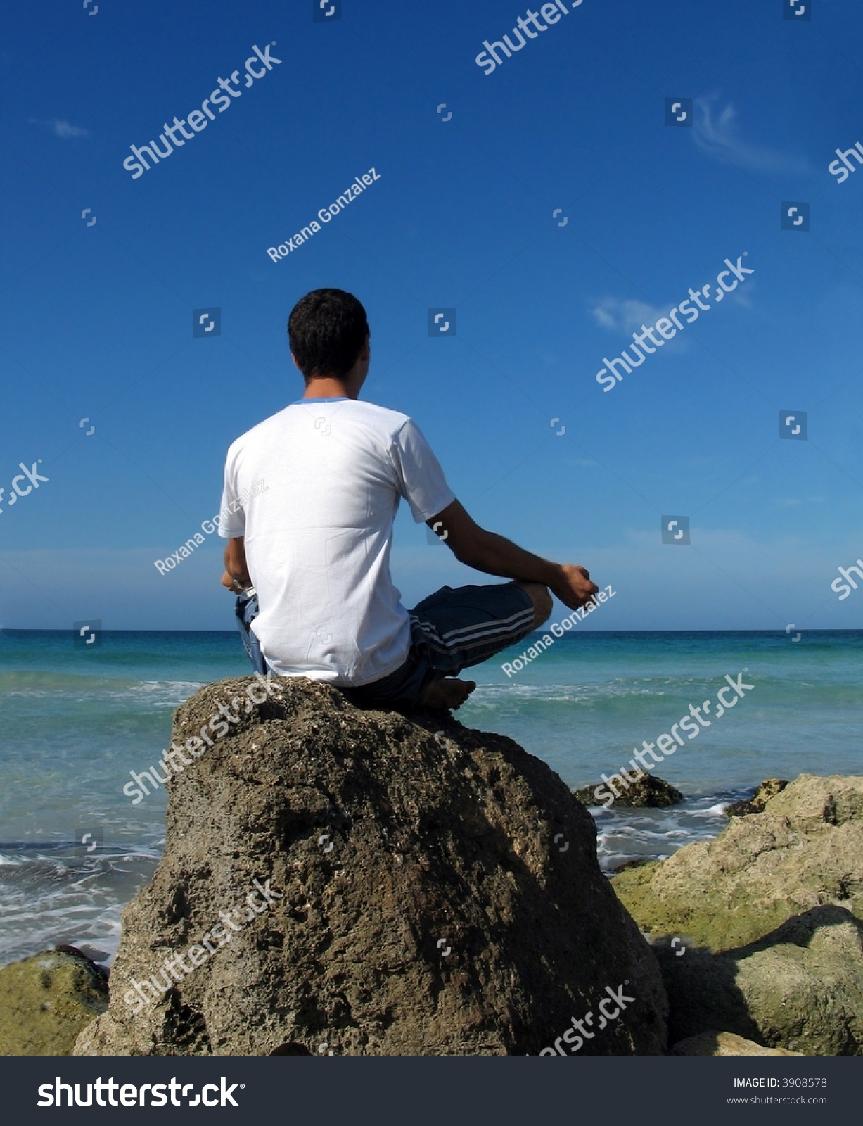 Beach Meditation - Young Boy Meditating On A Rock Stock Photo 3908578 ...