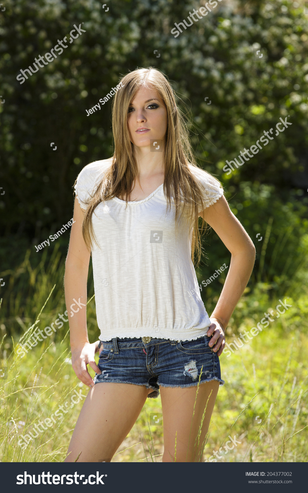 Girl in tight jeans shorts