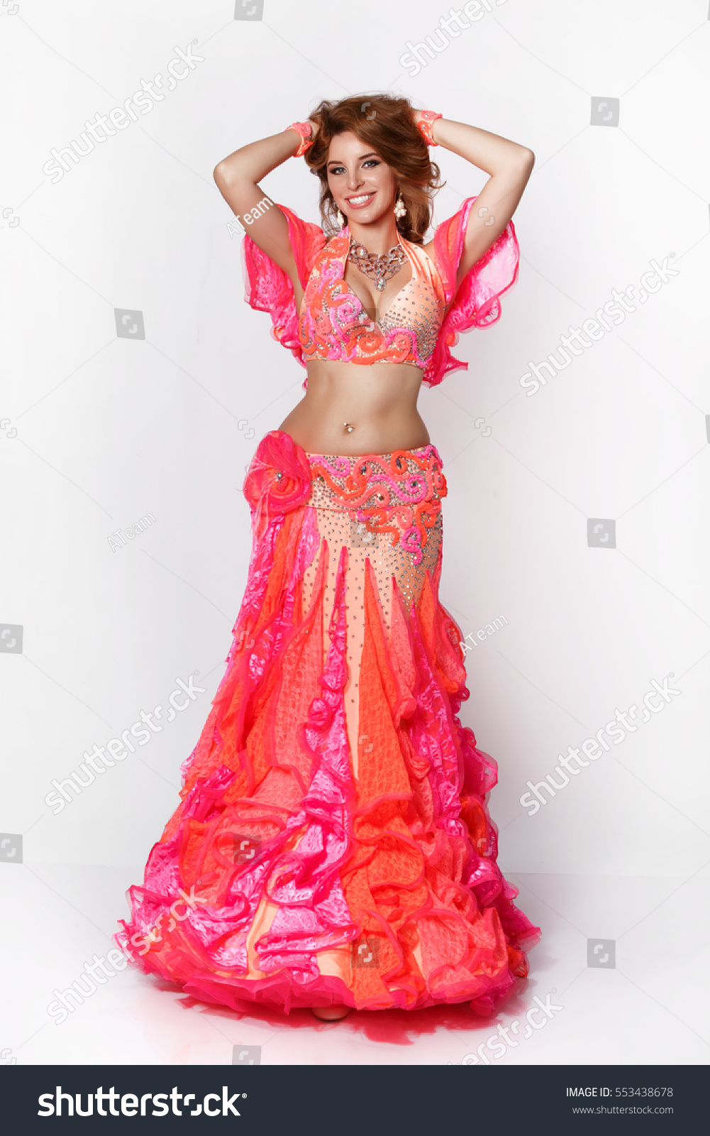 Beautiful Arabic Belly Dancer Harem Woman Plus Size In Orange Dress And Jewelry Dancing Arms In Beautiful Arabic Belly Dancer Harem Woman Plus Size In Orange Dress And Jewelry Dancing Arms In