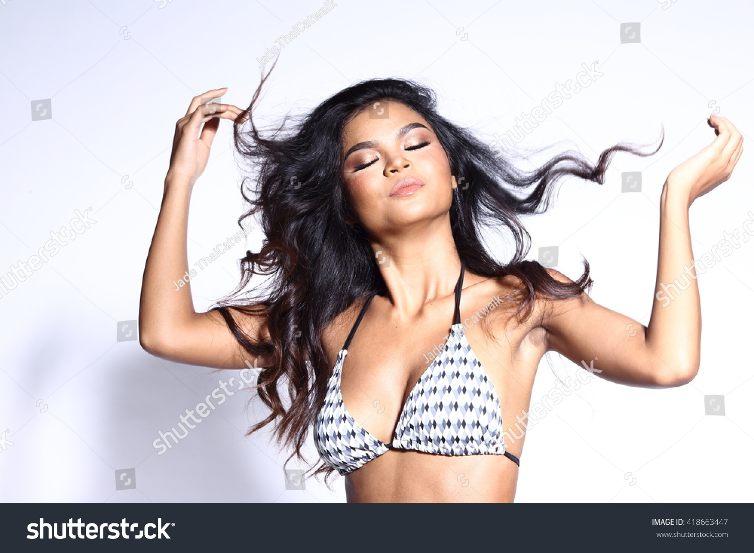 https://image.shutterstock.com/z/stock-photo-beautiful-asian-thai-model-woman-in-tan-skin-black-white-pattern-sport-swim-suit-fashion-make-up-on-418663447.jpg