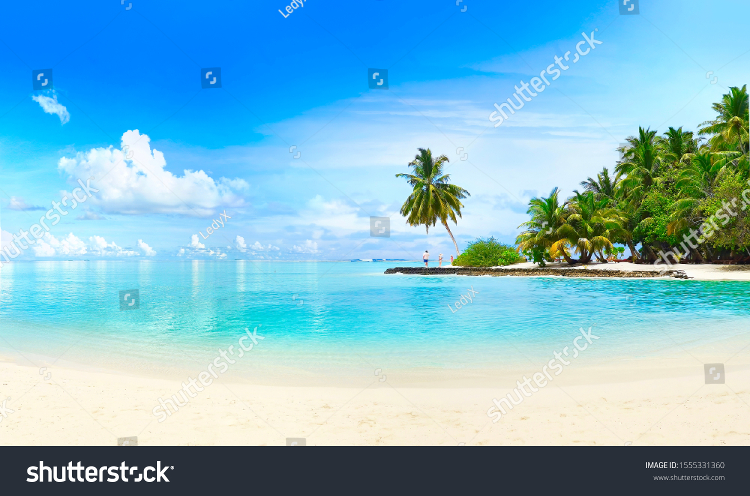 Beautiful beach with white sand, turquoise ocean, green palm trees and blue sky with clouds on Sunny day. Summer tropical landscape, panoramic view.