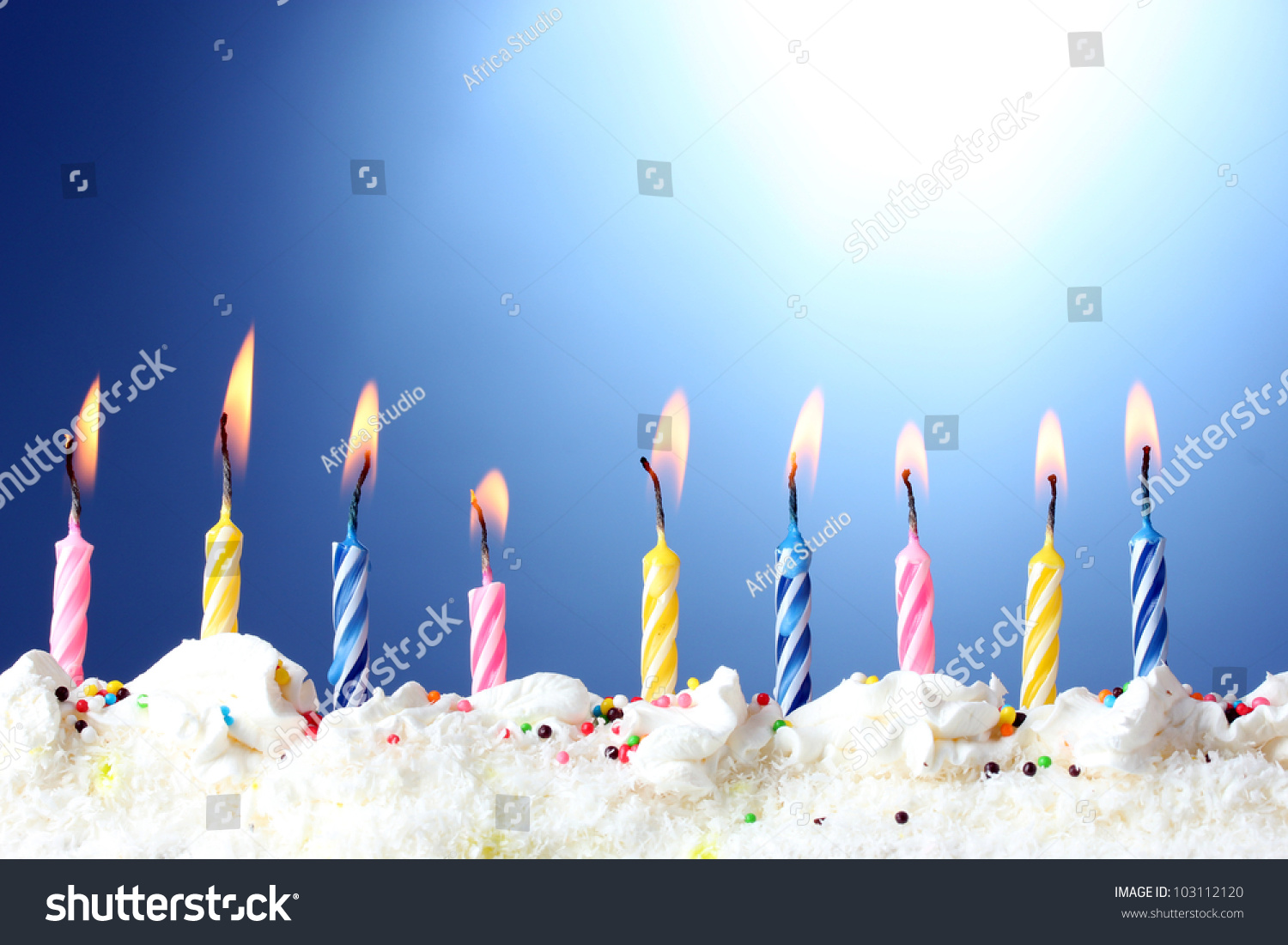 Beautiful Birthday Candles On Blue Background Stock Photo ...