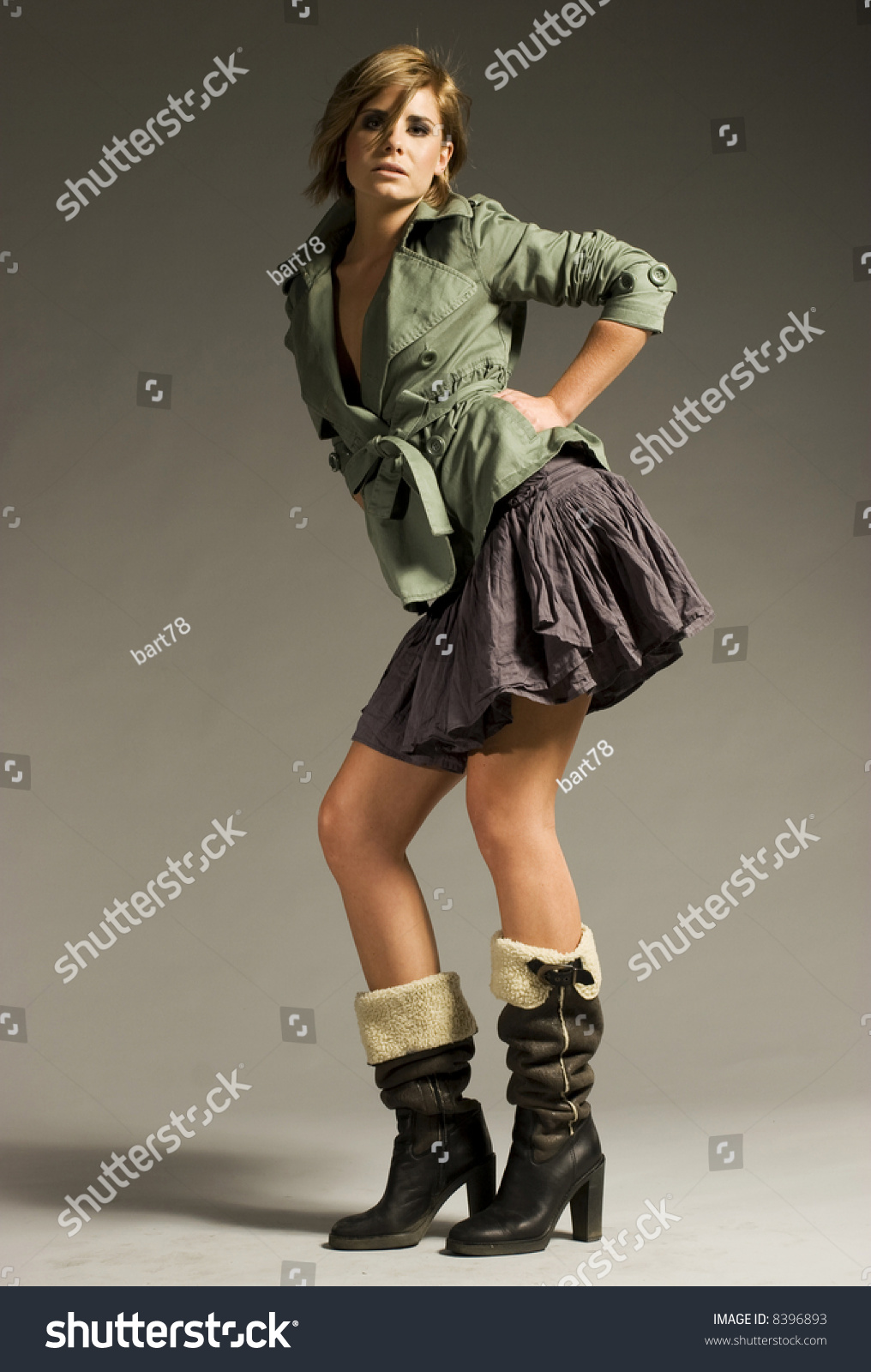 Beautiful blonde in boots in bed — 13