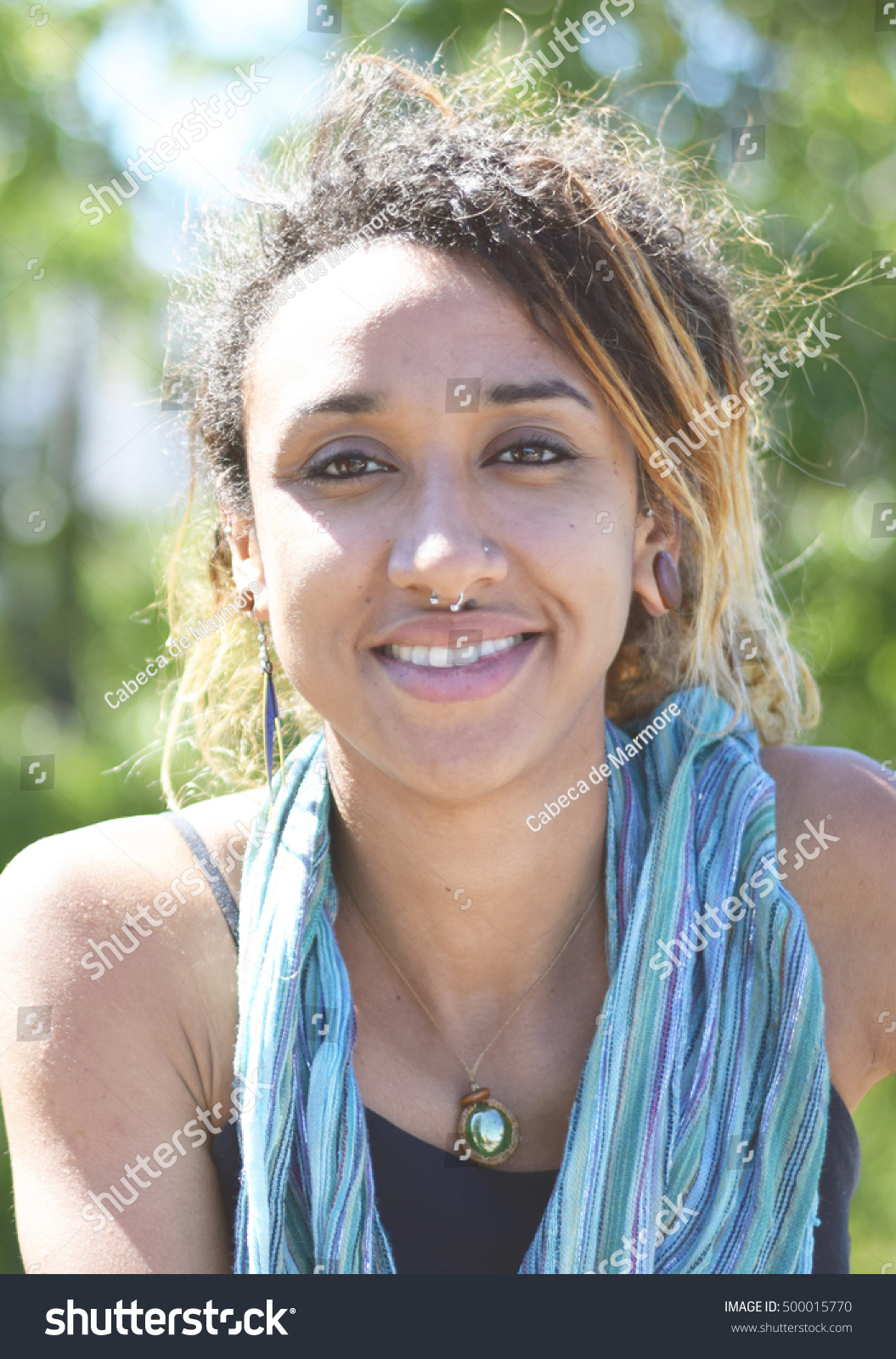 https://image.shutterstock.com/z/stock-photo-beautiful-brazilian-mixed-race-woman-smiling-outside-500015770.jpg