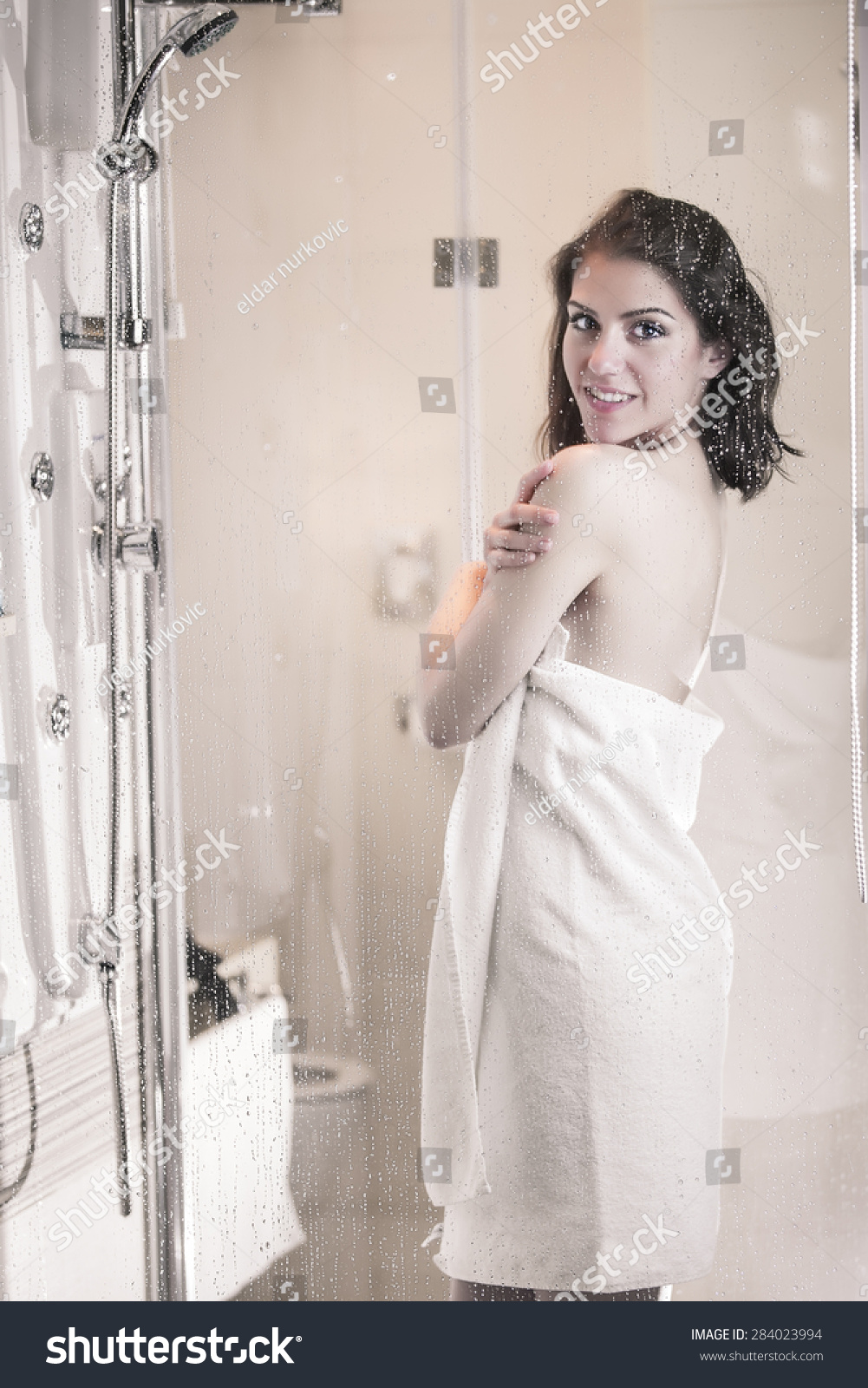Young brunette loves to be naked after the shower