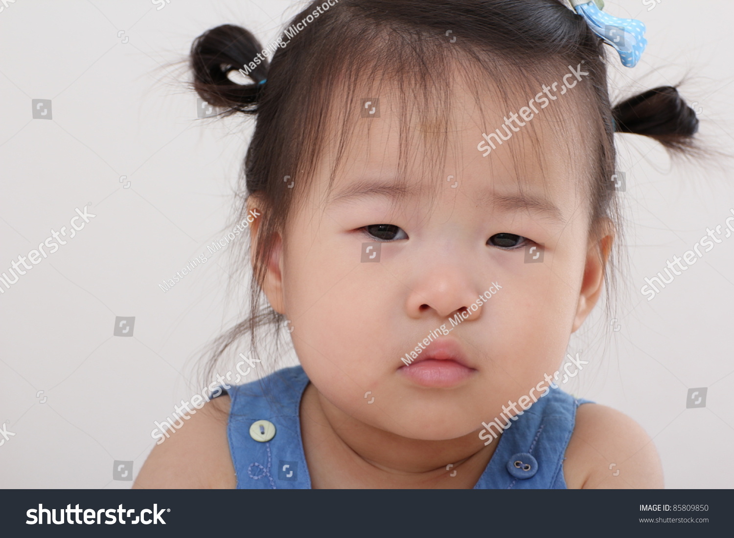 Beautiful Cute Asian Baby Toddler Girl With Bows In Hair Stock Photo ...