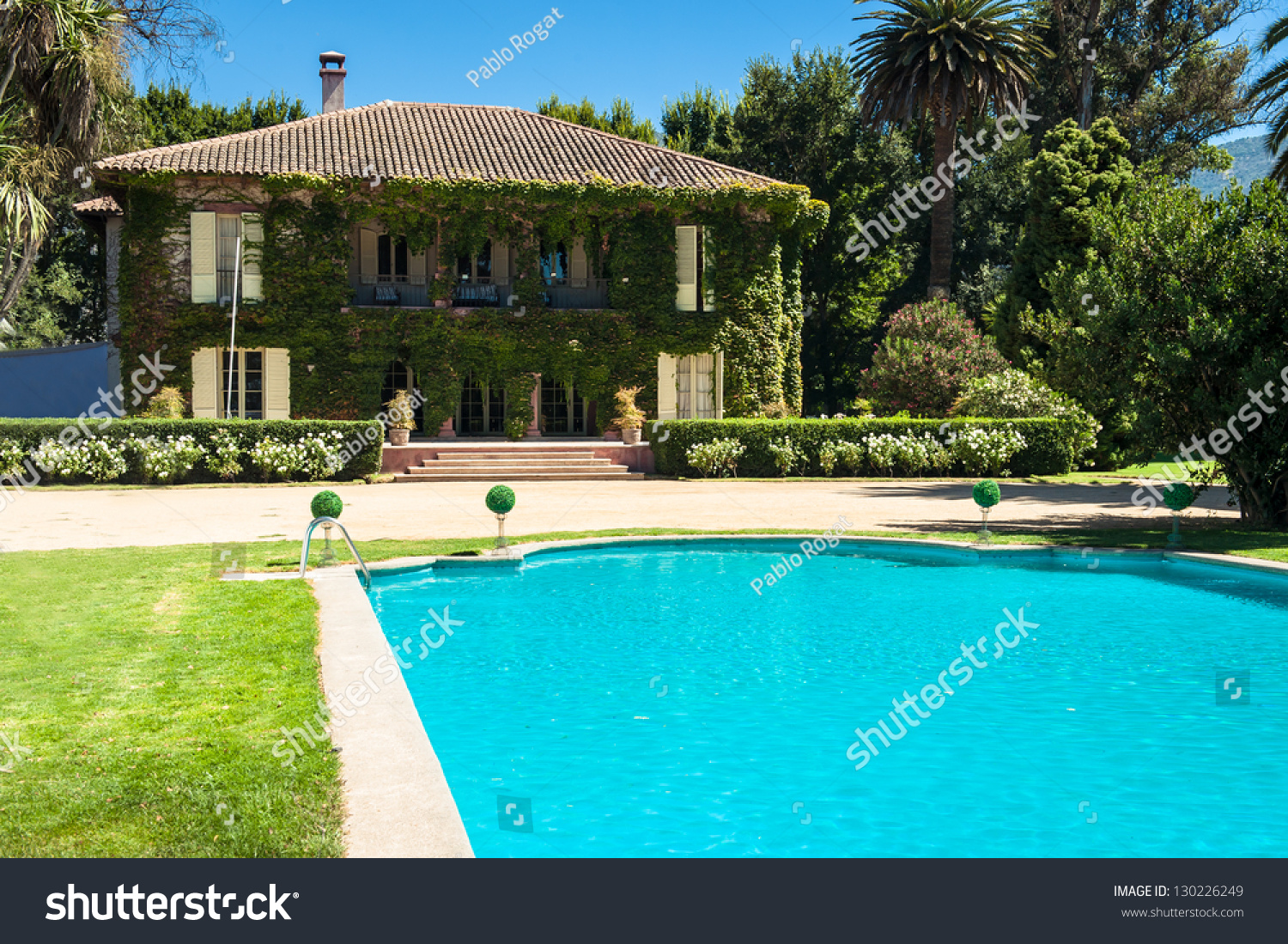 Beautiful House Backyard Swimming Pool Foreground Stock Photo