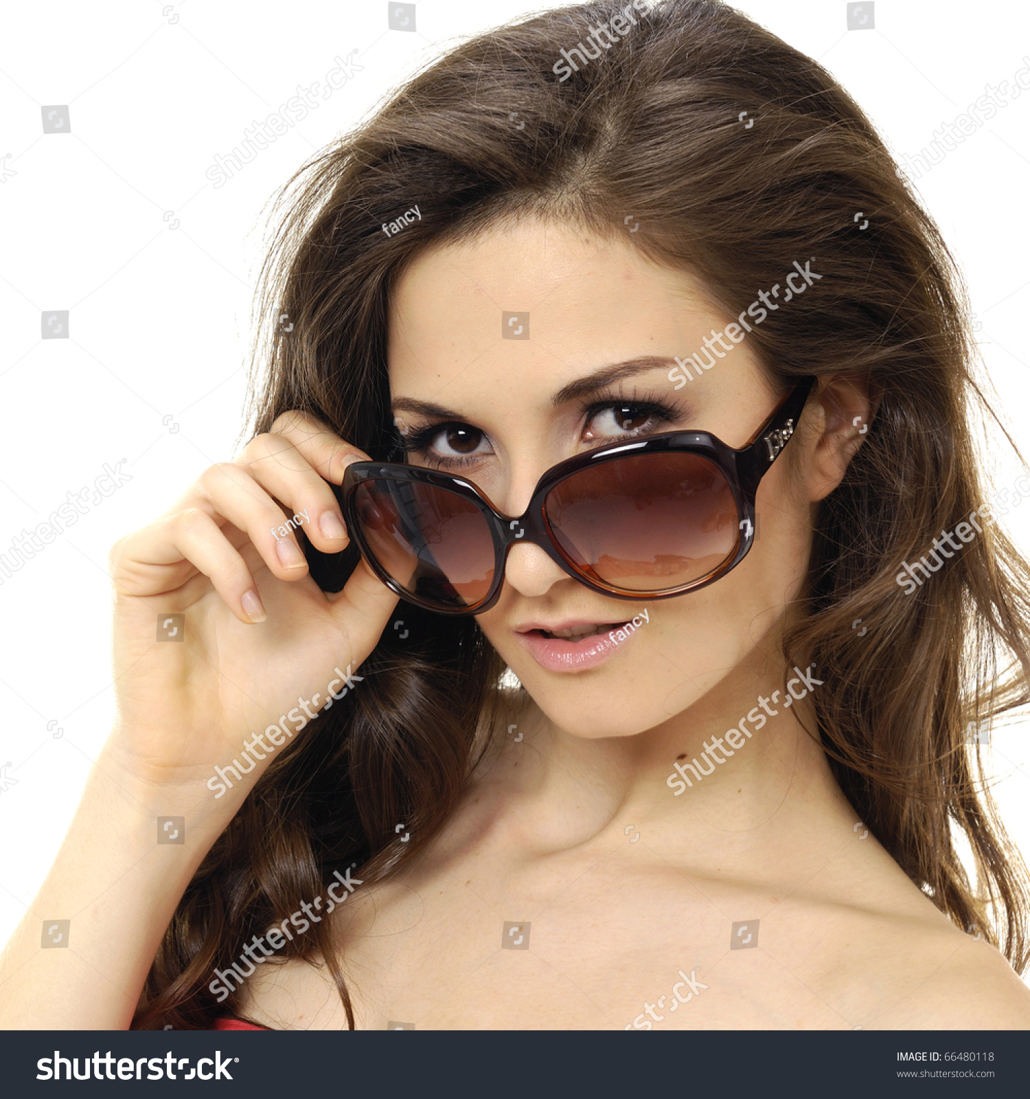 Beautiful Lady Looking Over Sunglasses Stock Photo Edit Now