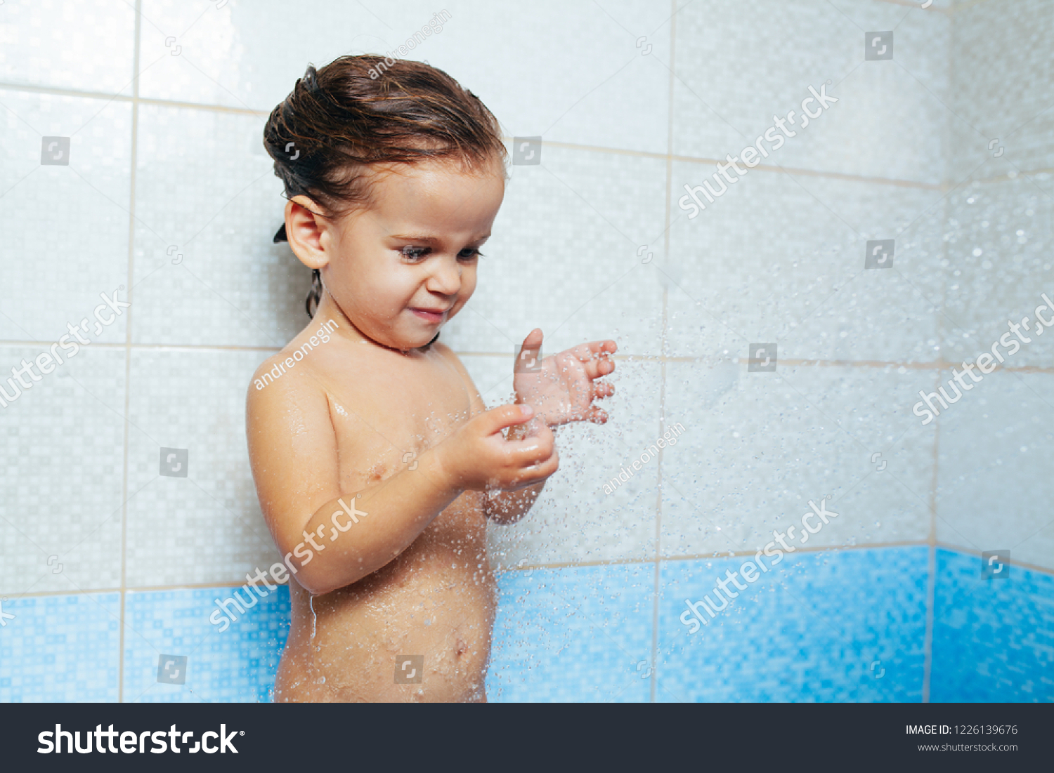 naked toddler girls and boy shower together