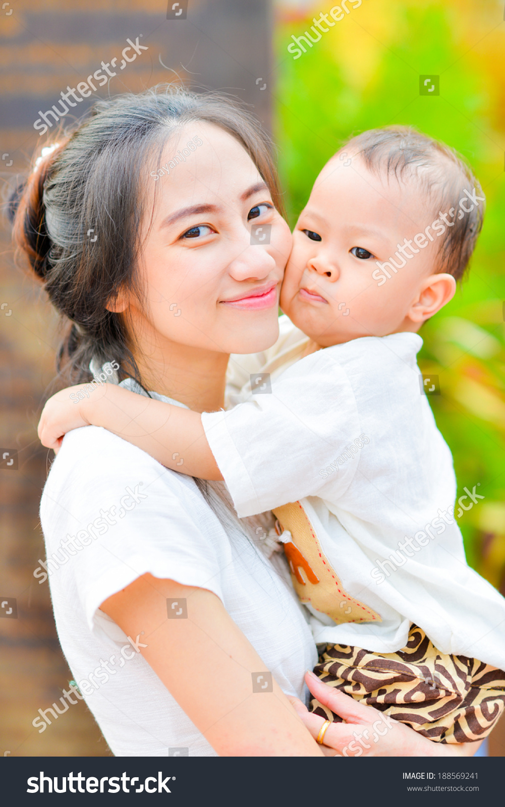 Beautiful Mom With Her Cute Baby. Stock Photo 188569241 : Shutterstock