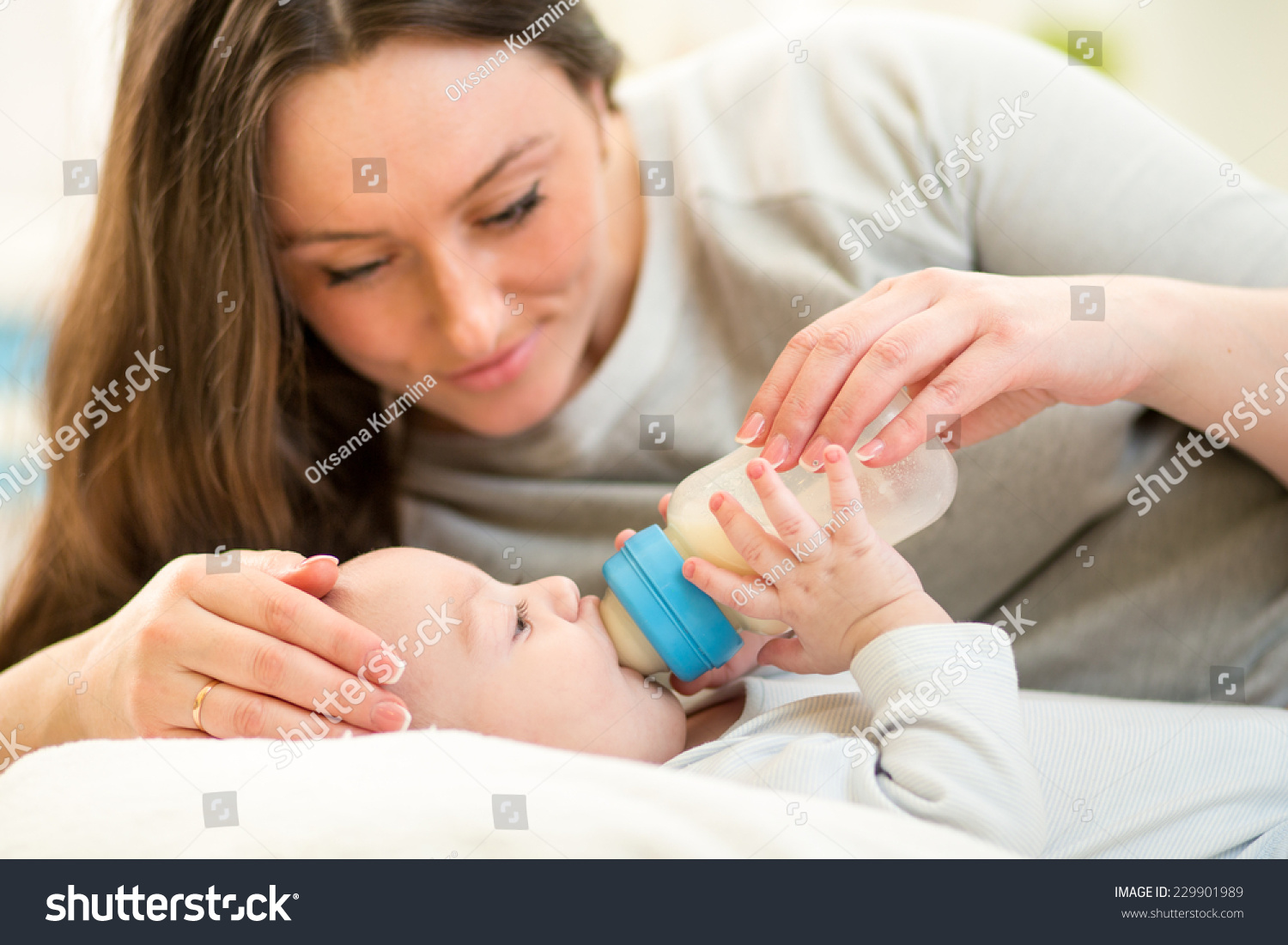 beautiful mother feeding baby