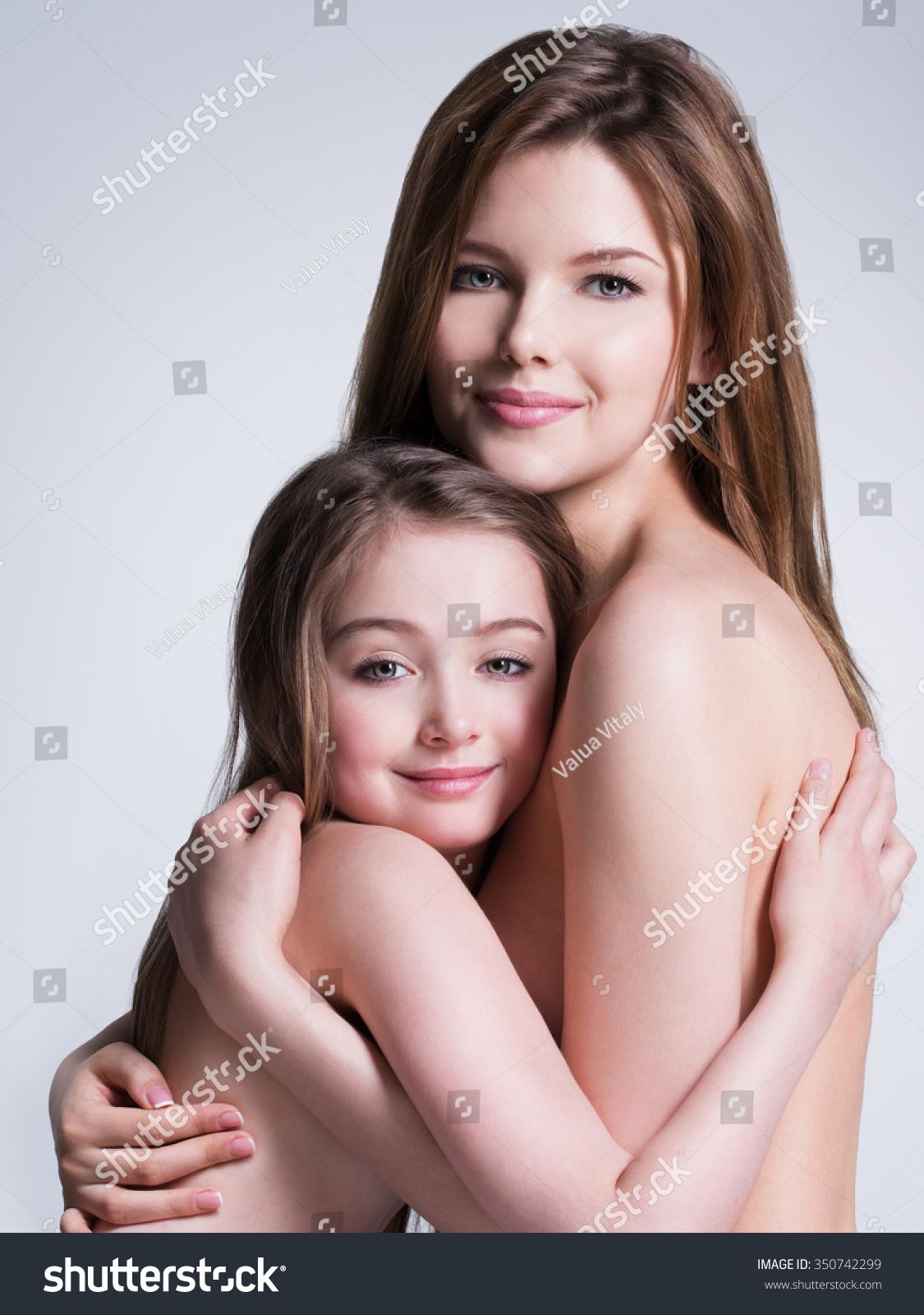 Naked mother and daughter