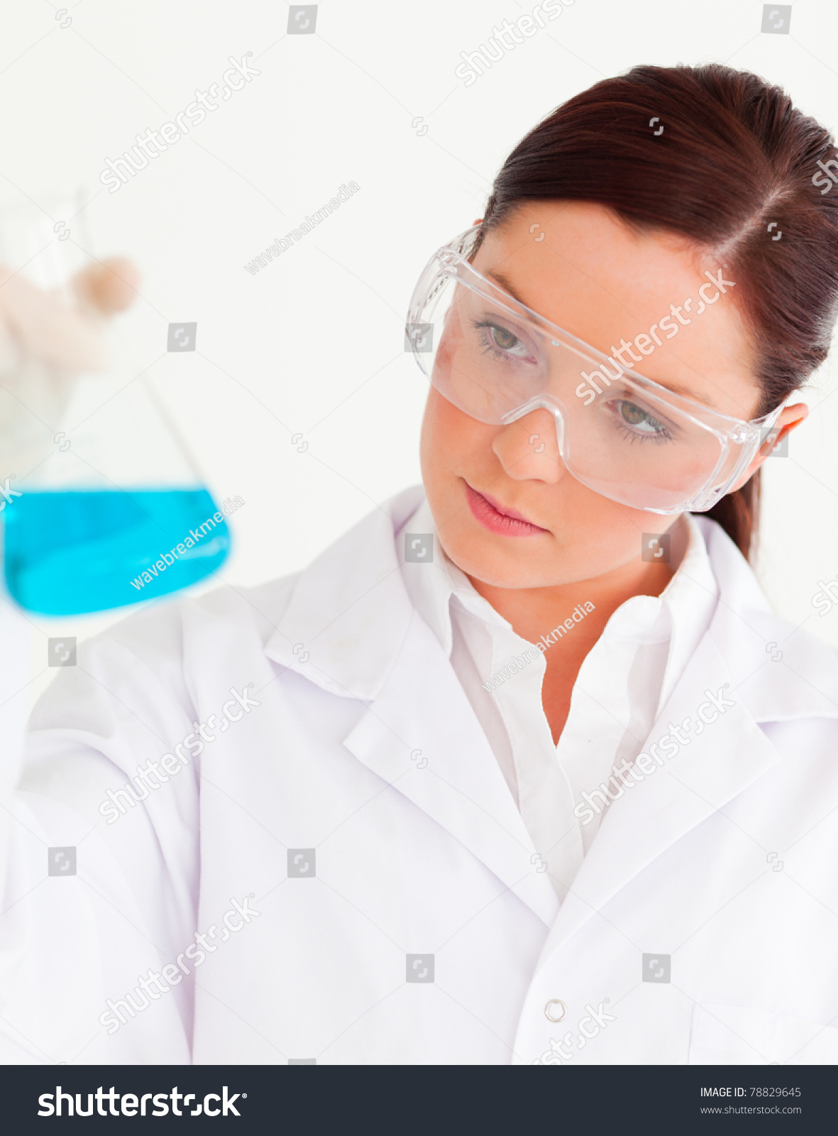 Beautiful Scientist Holding A Beaker In A Laboratory Stock Photo ...