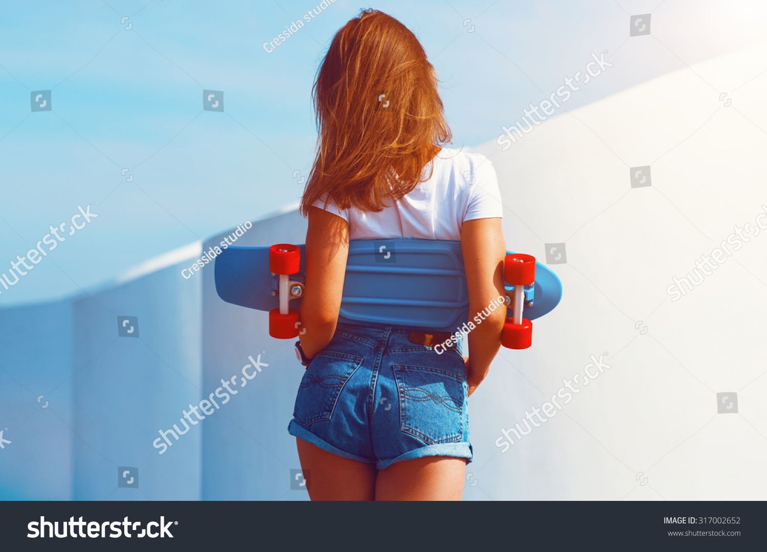 Beautiful Sexy Young Girl In Short Shorts Walking With Longboard In ...