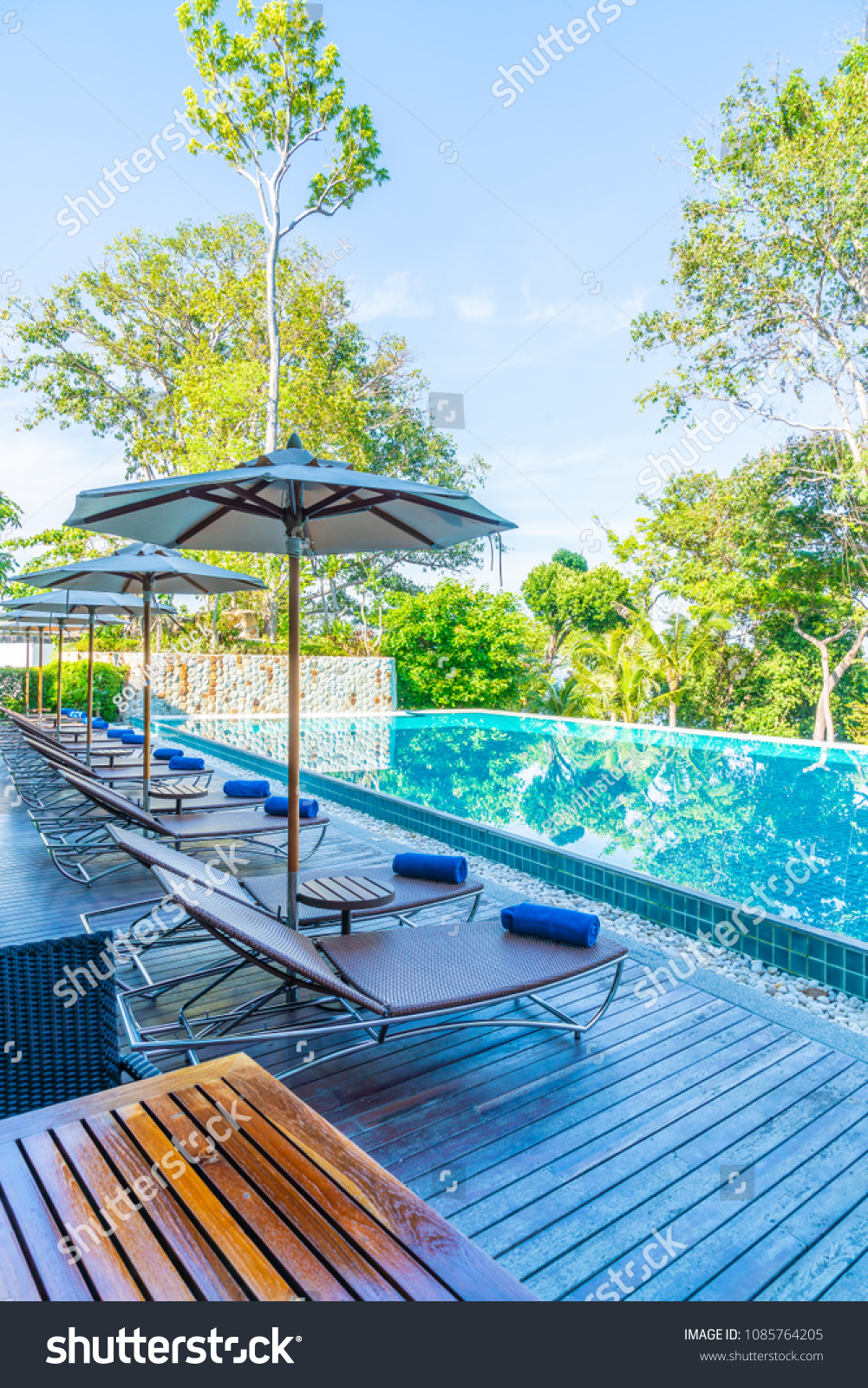 Beautiful Umbrella Chair Around Swimming Pool Stock Photo