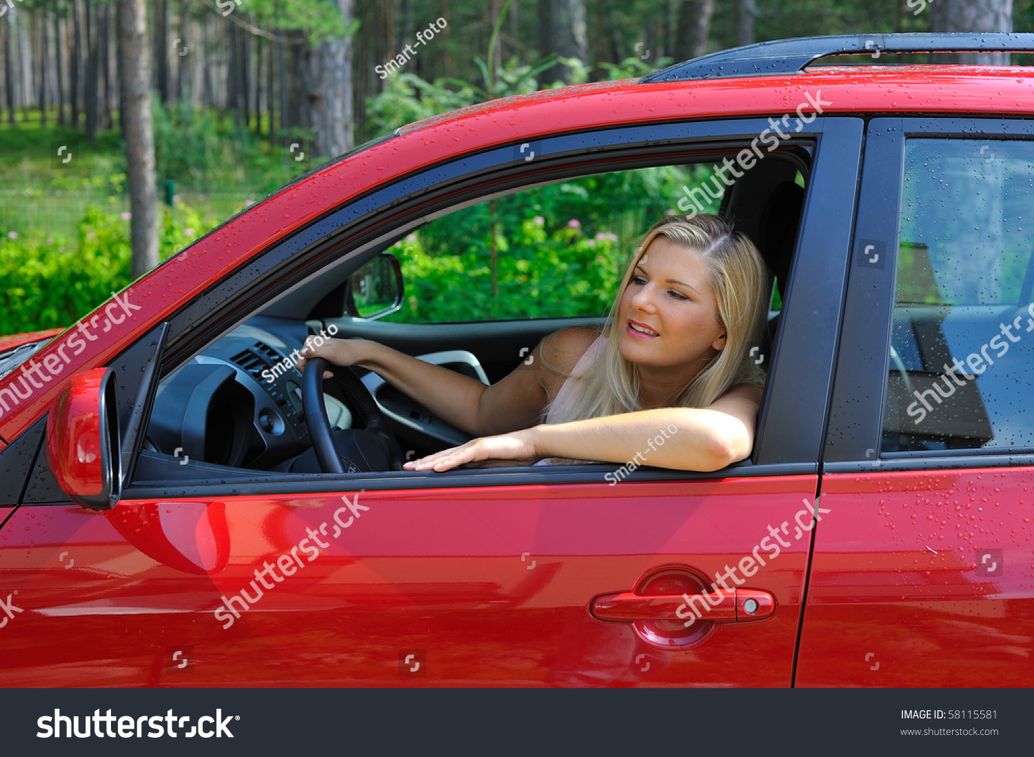 Beautiful Woman Driver In Red Shiny Car Outdoors Smiling Stock Photo ...