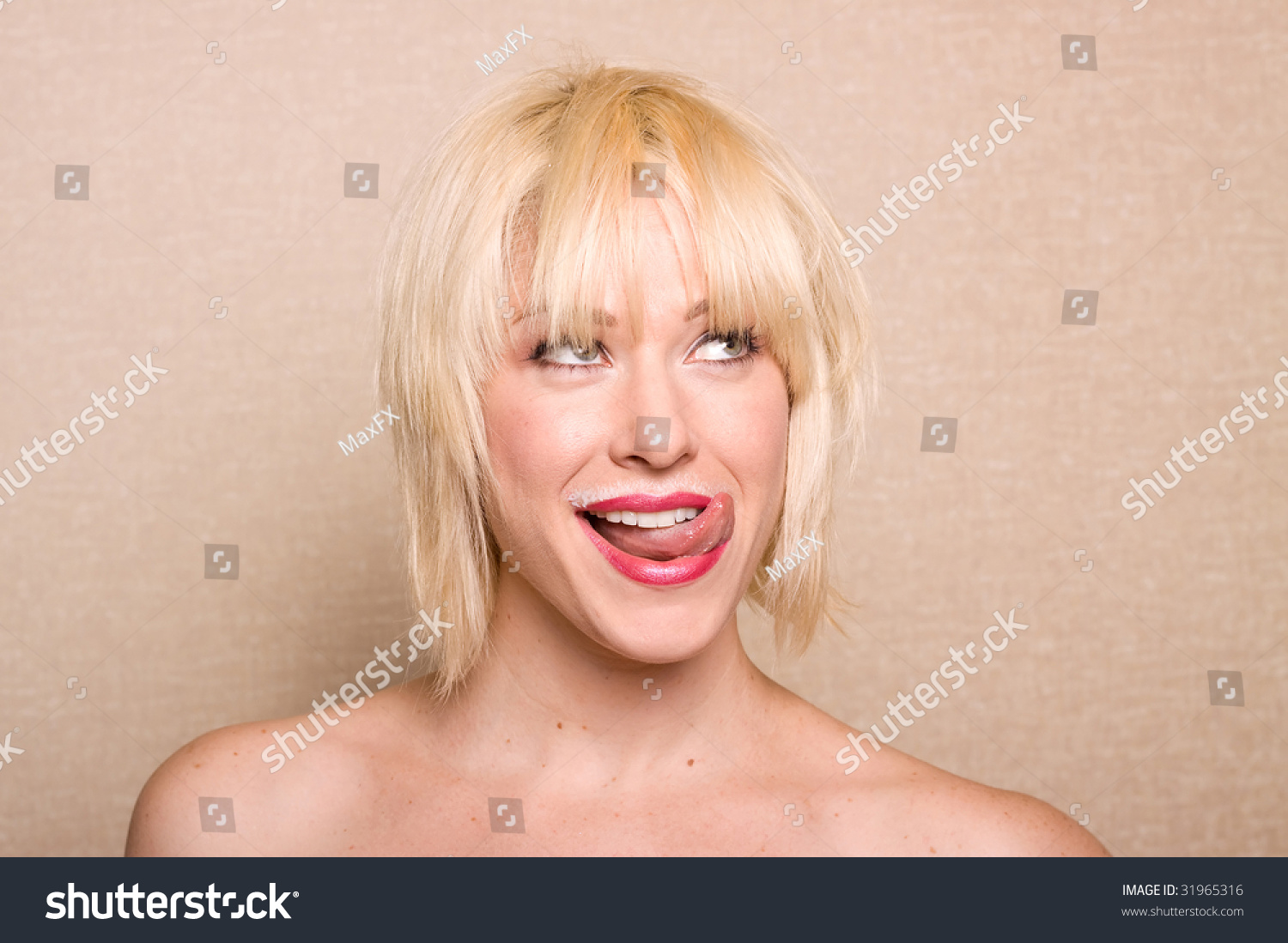 Beautiful Woman Sticking Her Tongue Out After Drinking Milk Stock Photo ...