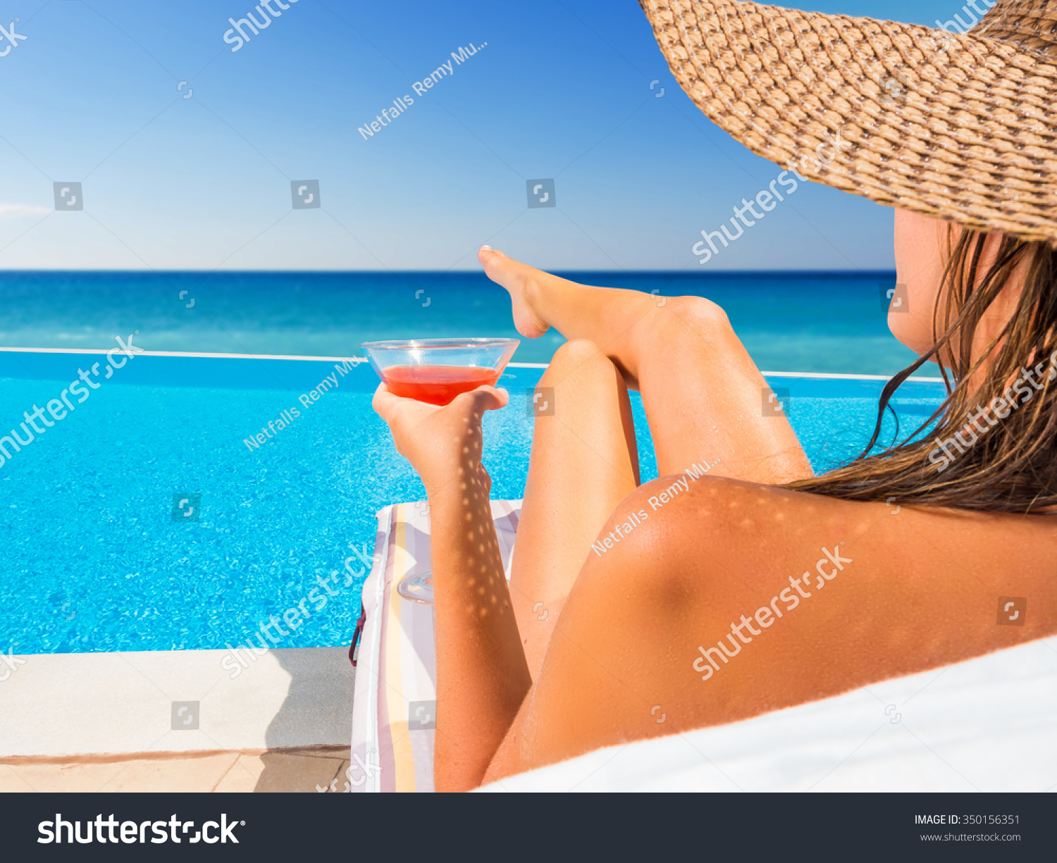 beautiful woman hat relaxing infinity pool stock photo 350156351 beautiful woman hat relaxing infinity pool stock photo 350156351