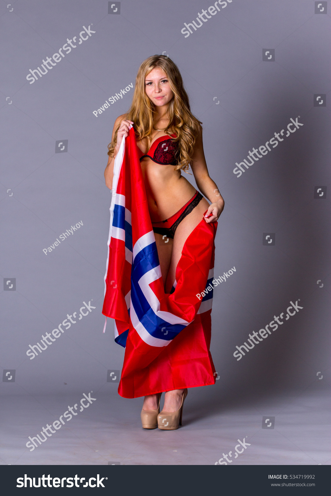 https://image.shutterstock.com/z/stock-photo-beautiful-woman-with-flag-of-norway-534719992.jpg
