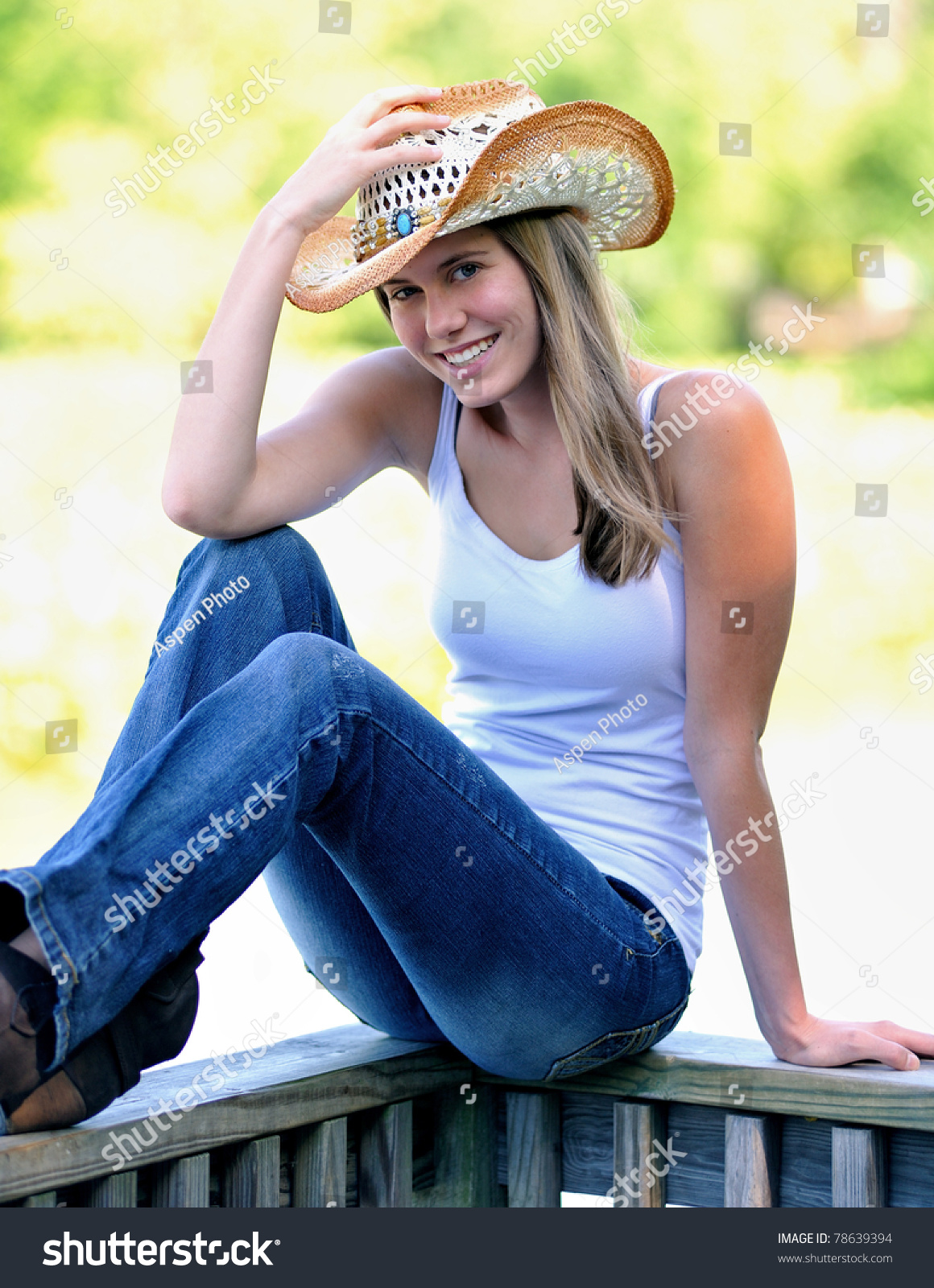 Beautiful Young Country And Western Girl In White Tank Top, Blue Jeans ...