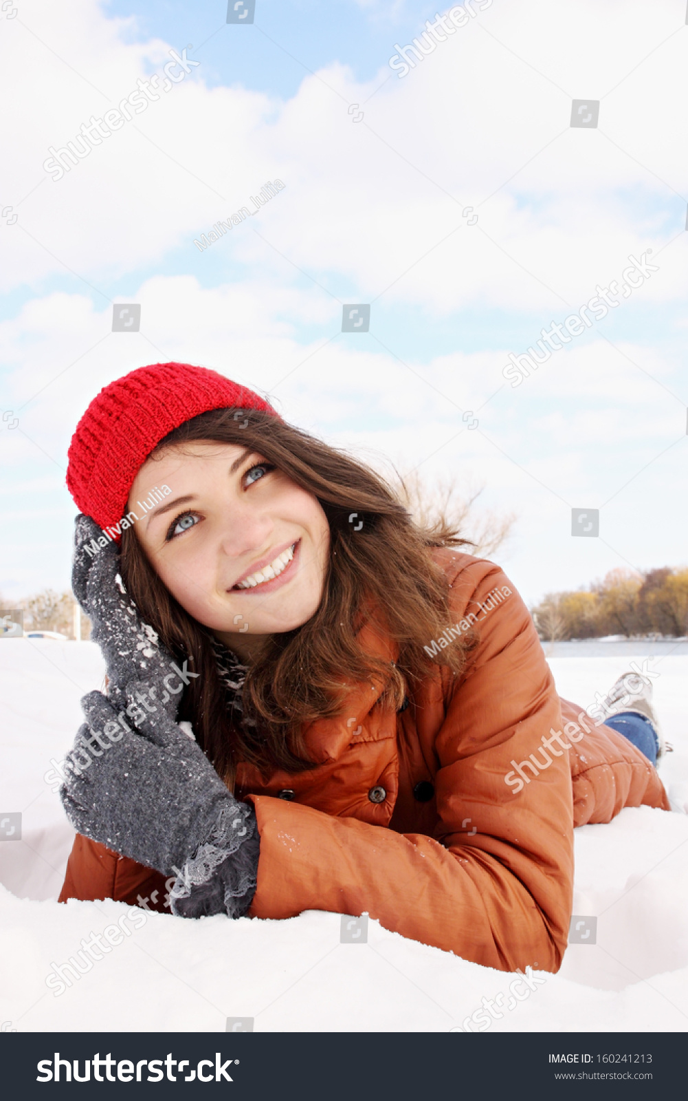 Beautiful Young Woman Lying In The Snow Stock Photo 160241213 ...