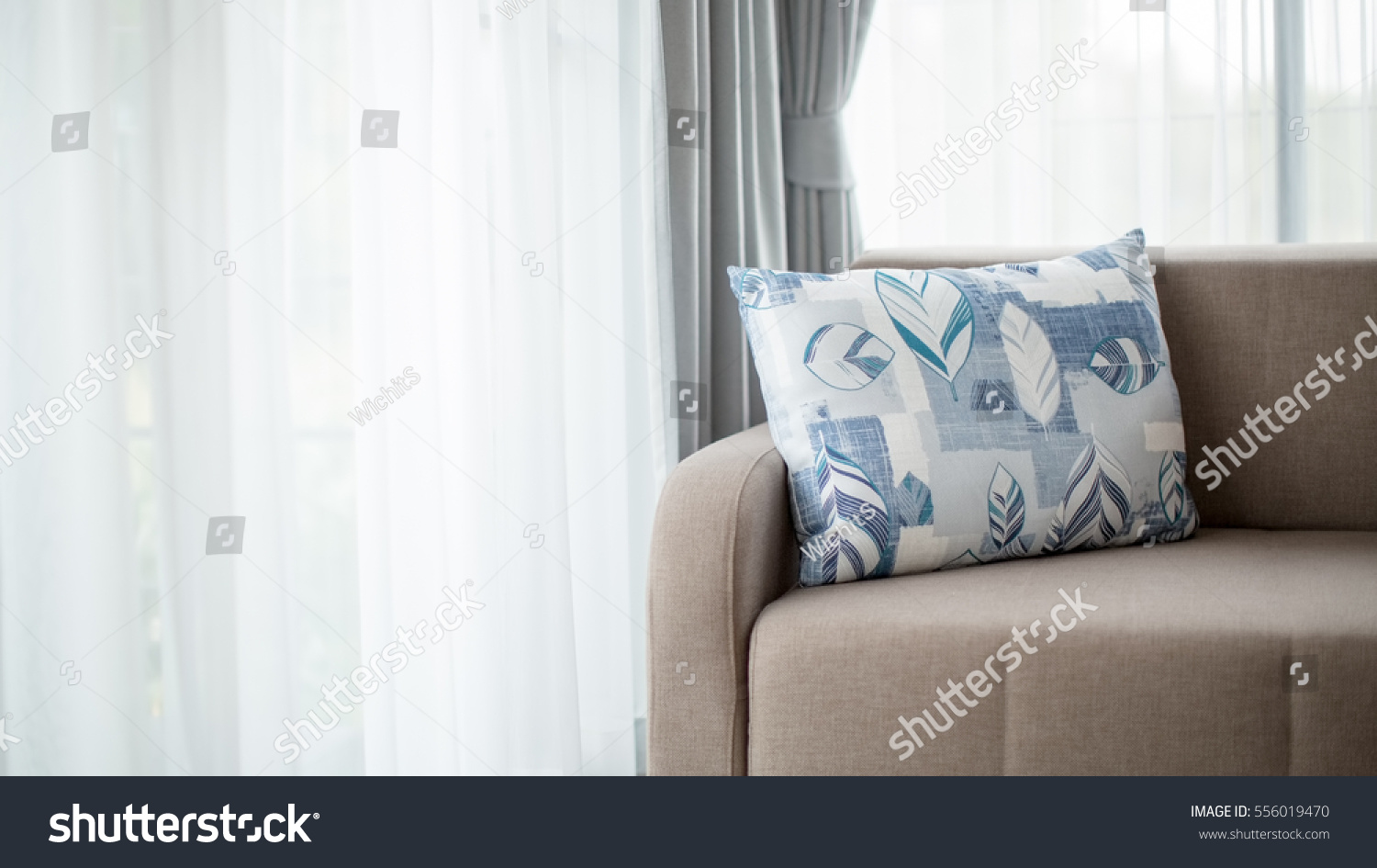 Beige Color Sofa Large Pillow Living Stock Photo Edit Now 556019470   Stock Photo Beige Color Sofa With Large Pillow In A Living Room With Large Windows And White Light Curtain 556019470 