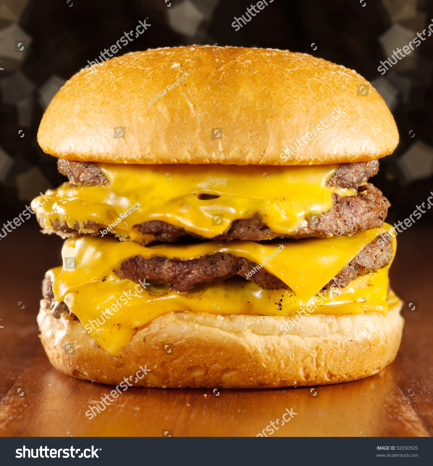 Big Cheeseburger With Melted Cheese And Glittery Background. Stock ...