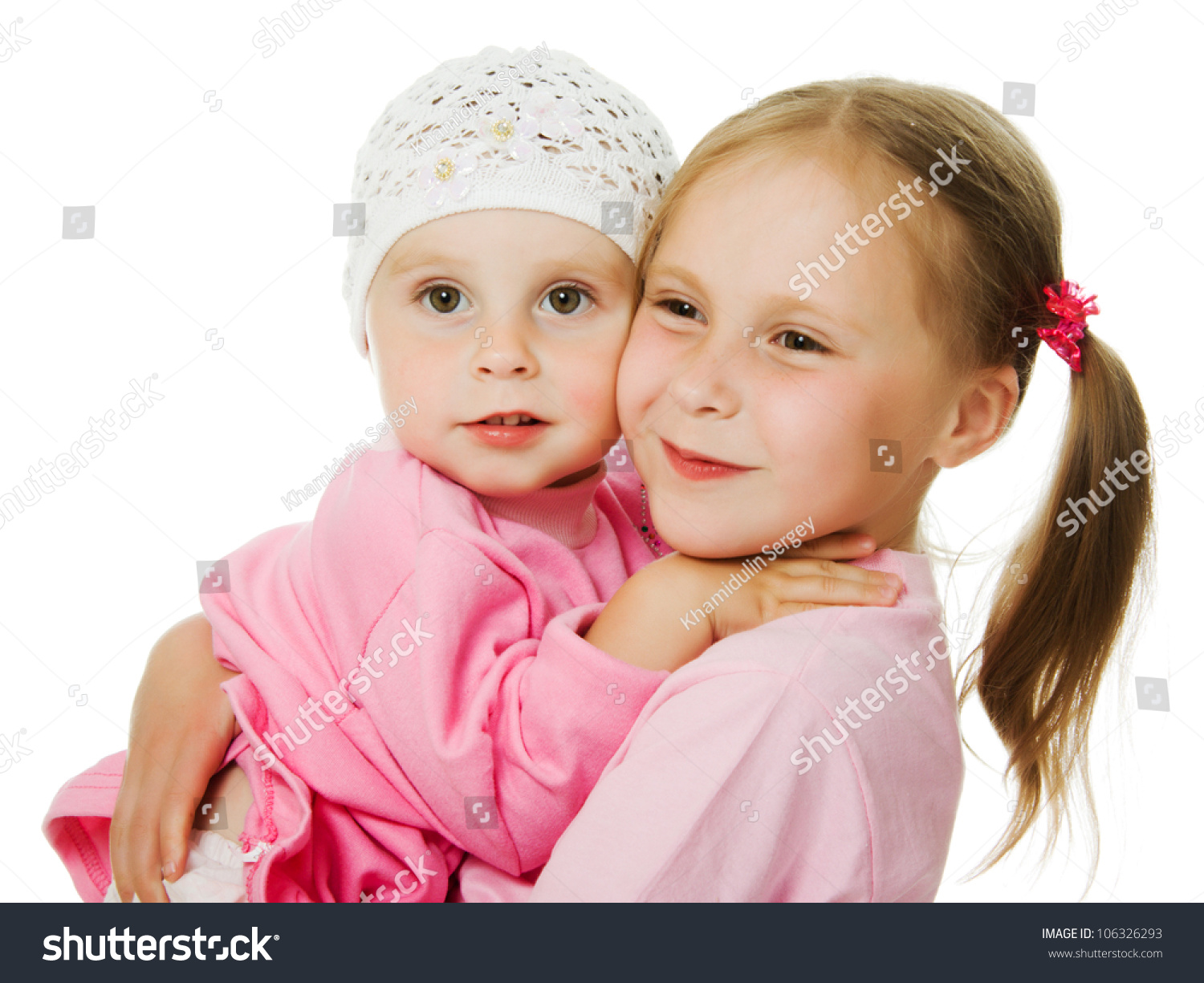 Big Sister, Little Sister Hugging On A White Background. Stock Photo ...