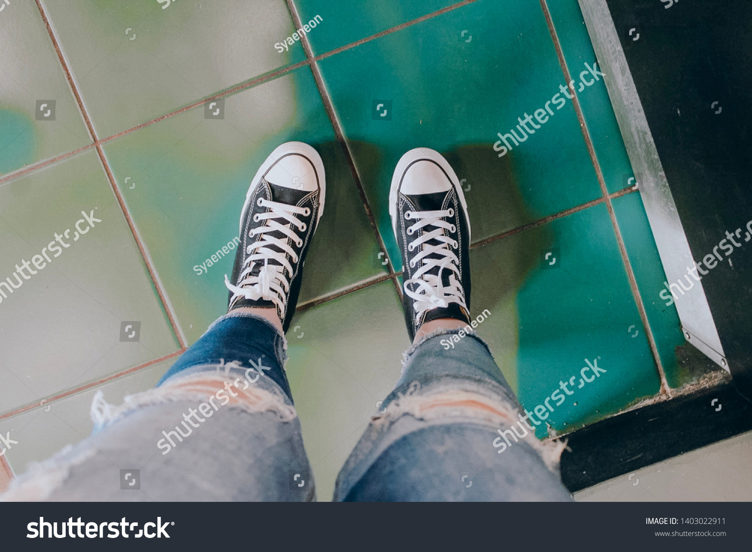 converse and ripped jeans