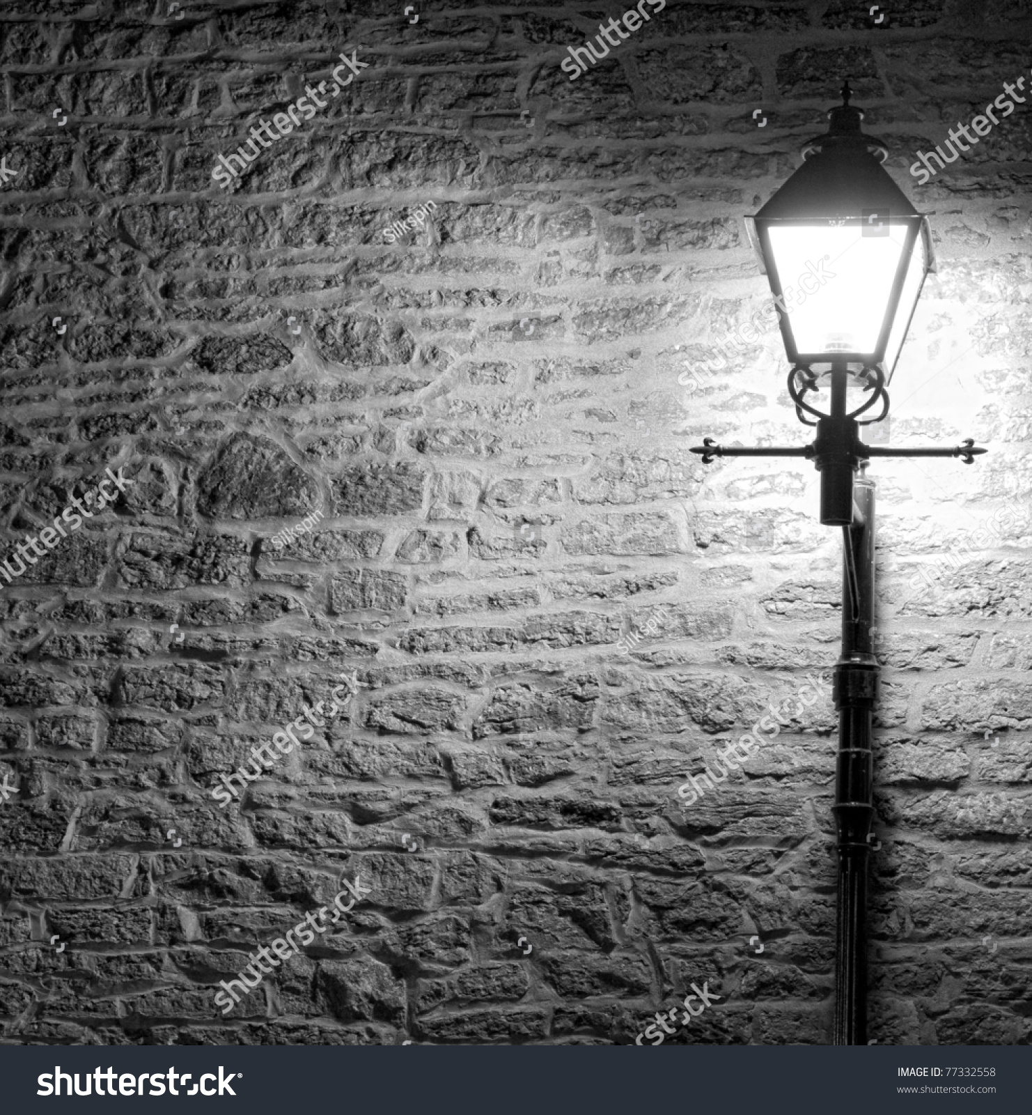 Black And White Image Of A Brightly Lit Lamp Post Against A Textured ...
