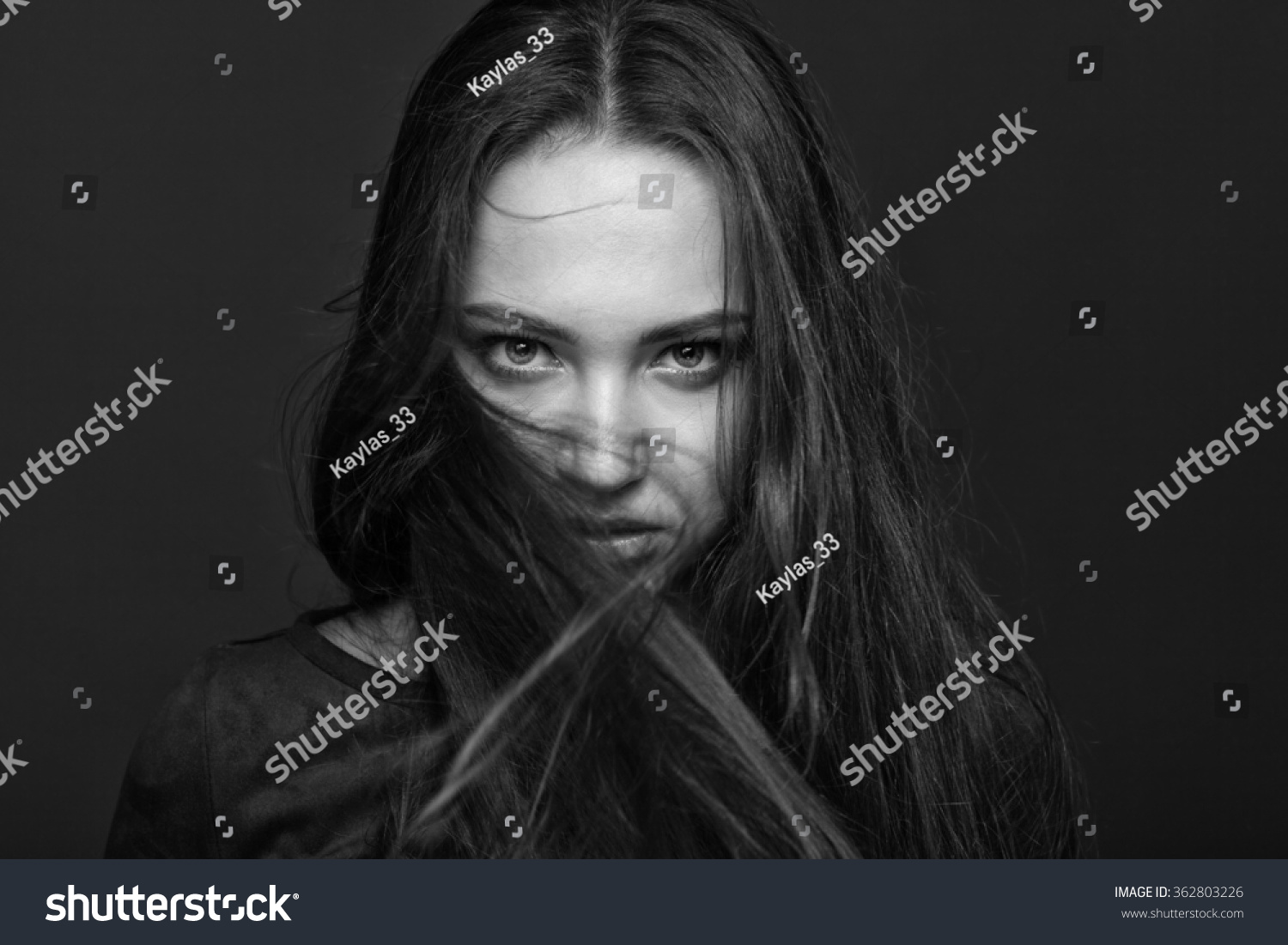 Black And White Portrait Of A Girl With A Stern Look Stock Photo ...