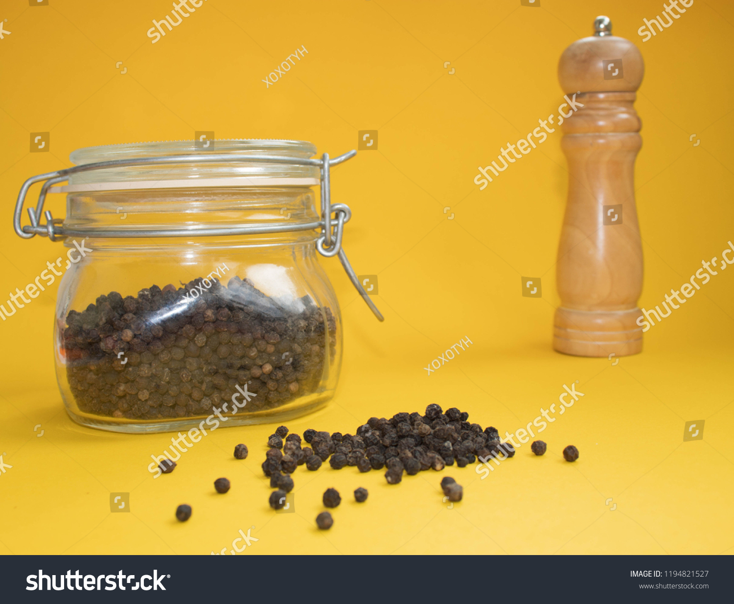 Download Black Pepper On Yellow Background Pepper Stock Photo Edit Now 1194821527 Yellowimages Mockups