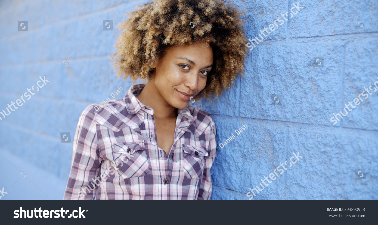 Black Woman Leaning Against Wall Stock Photo Edit Now 393890953