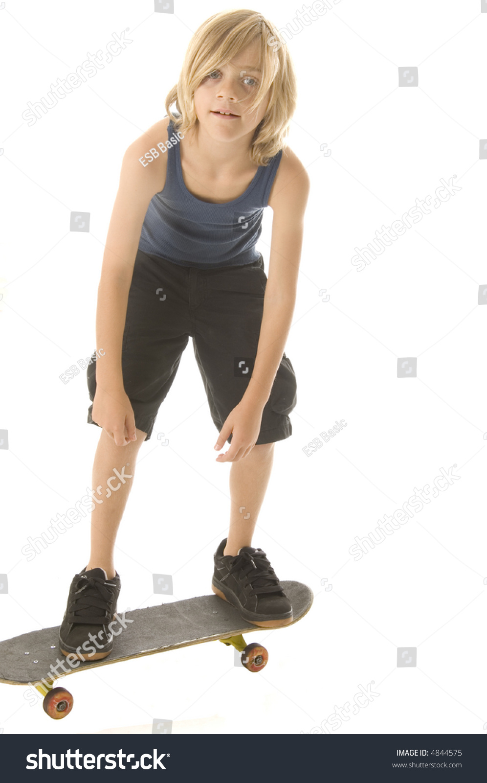 Blond Caucasian Boy Of Ten Stands On Skateboard; White Background Stock ...