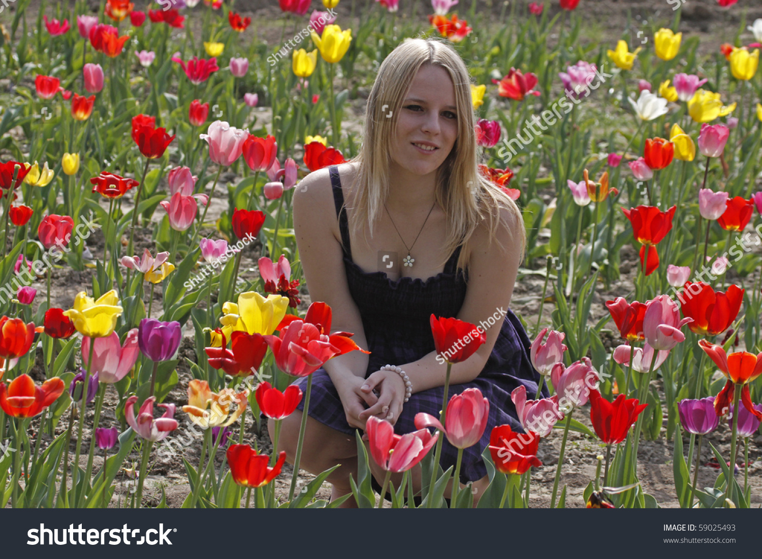 Blond Girl In Spring In A Tulip Field Stock Photo 59025493 : Shutterstock
