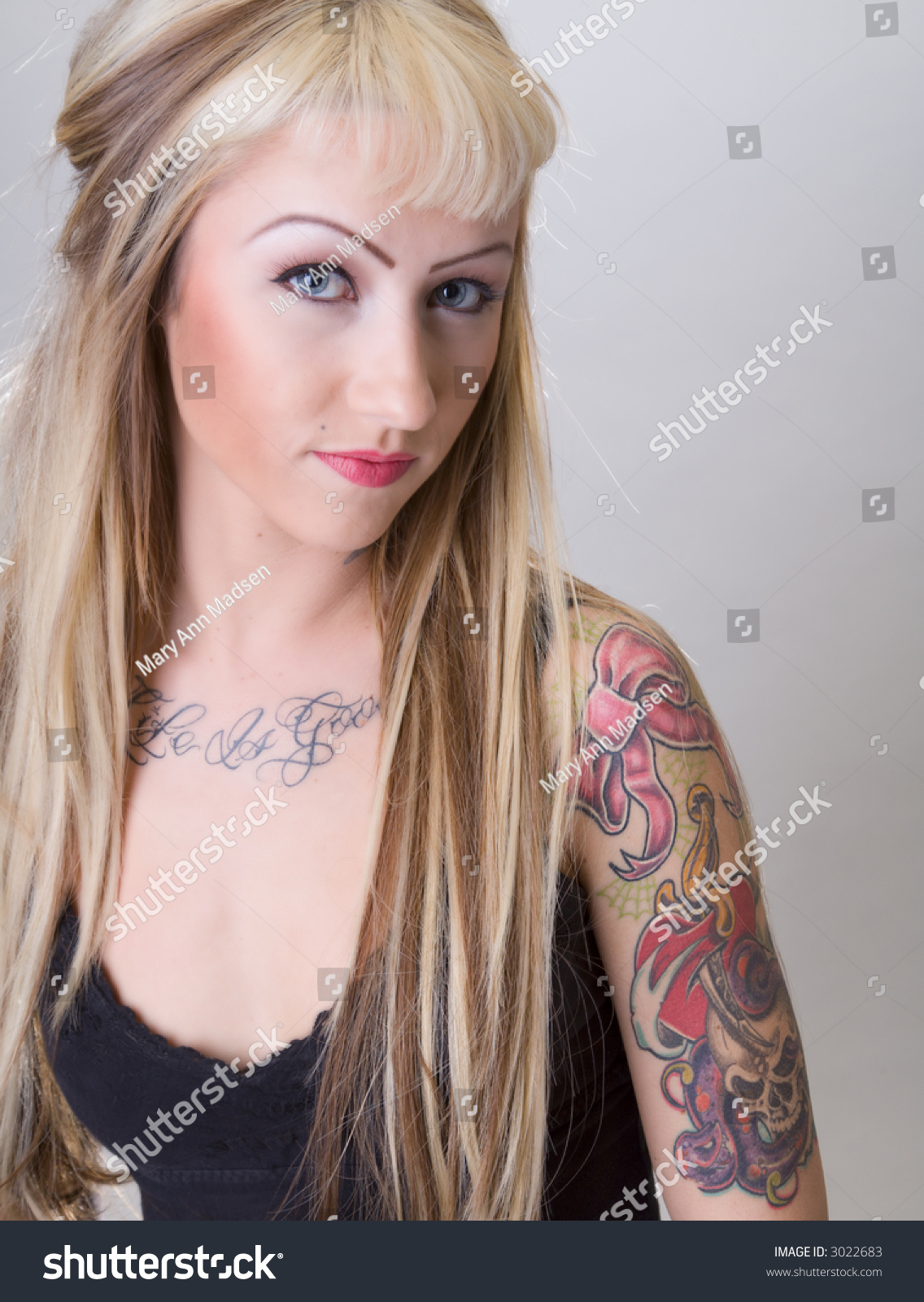 Blonde Biker Chick Covered In Tattoos And A Smug Expression Stock Photo ...