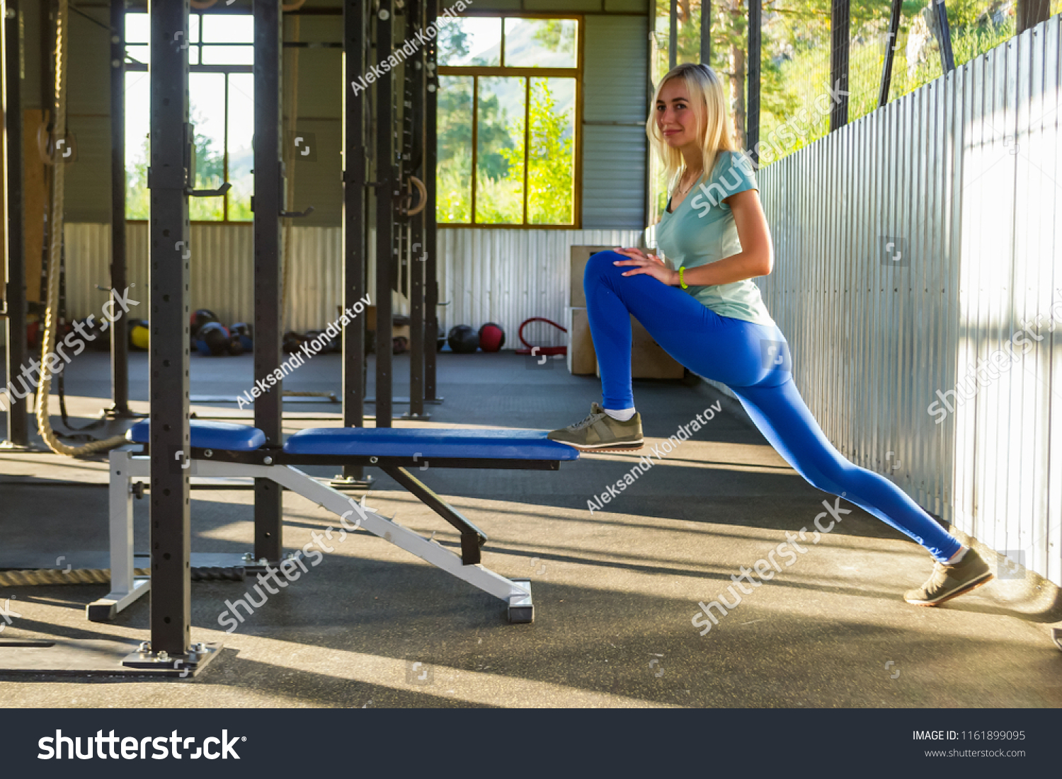 Blonde Girl Blue Leggings Does Stretching Stock Photo Edit Now