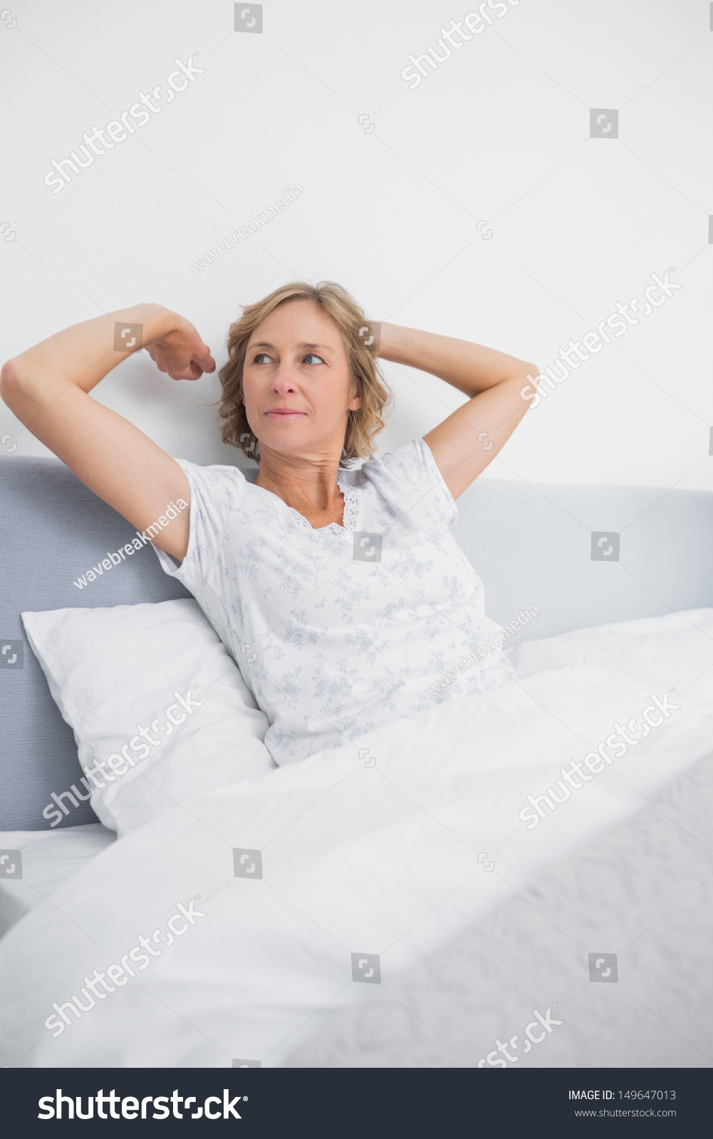 Blonde Woman Stretching Looking Away Bed Stock Photo 149647013 ...