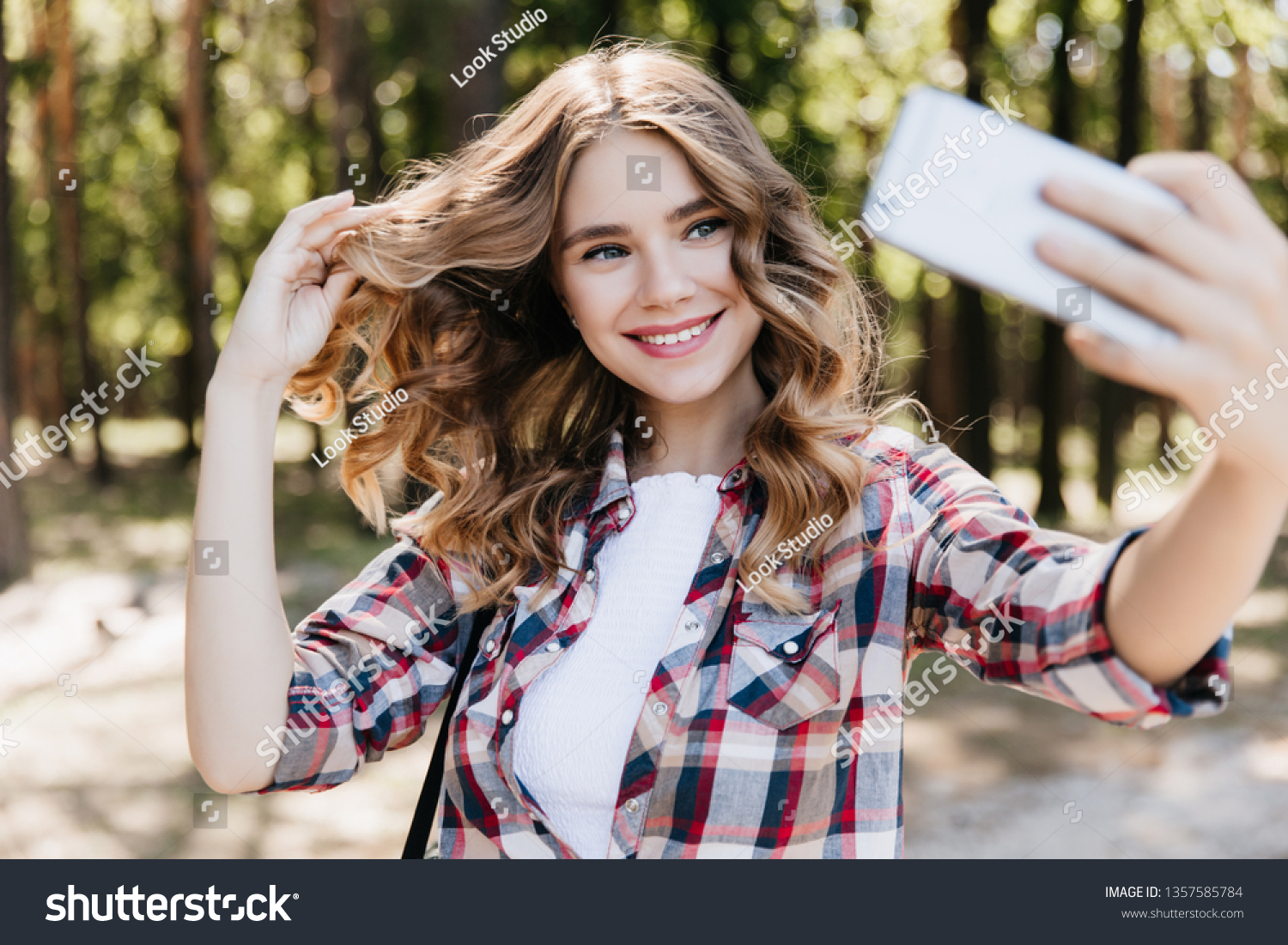 Blueeyed Shy Girl Using Phone Selfie Stock Photo Edit Now 1357585784