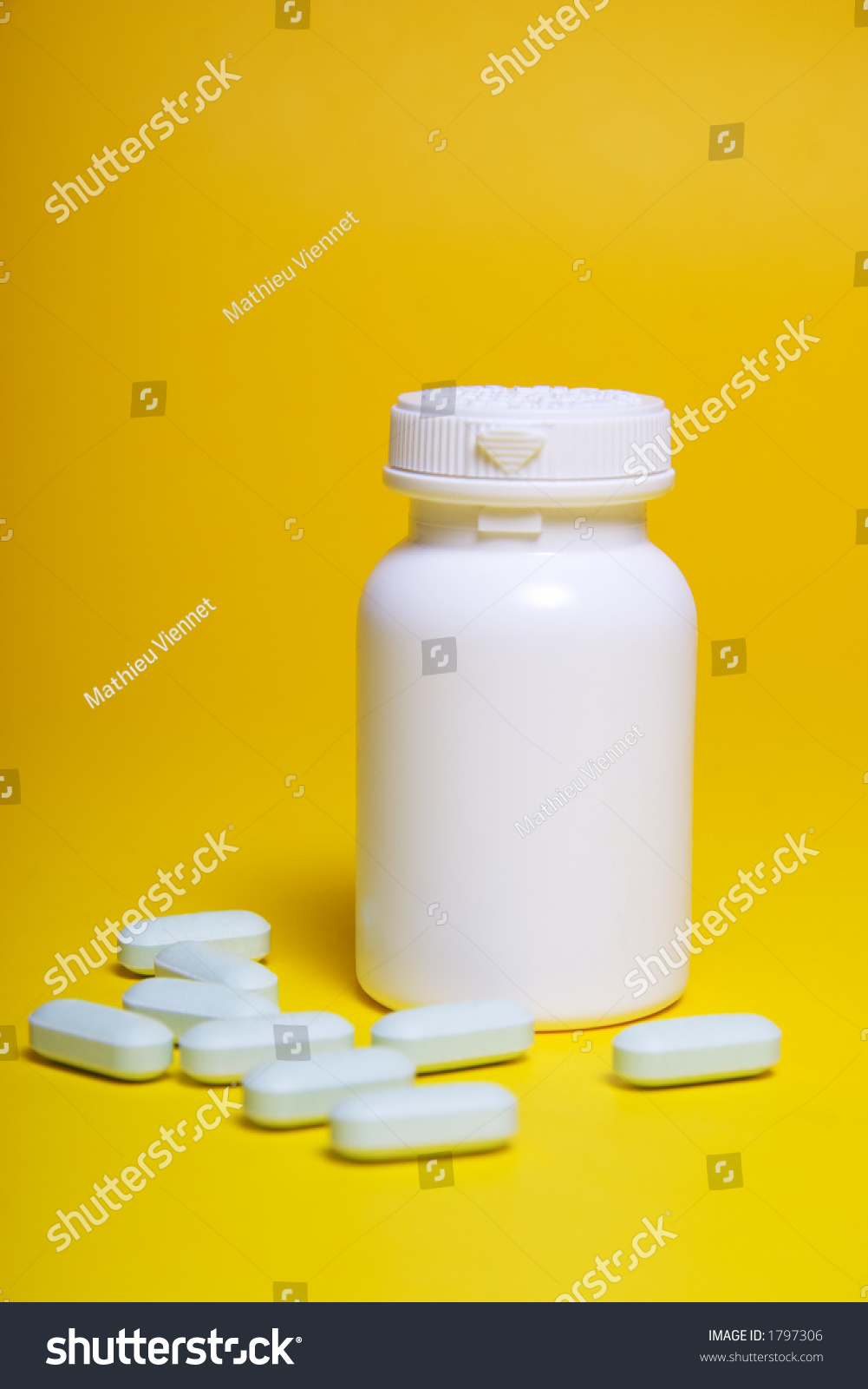 Blue Pills Bottle On Yellow Background Stock Photo Edit Now 1797306