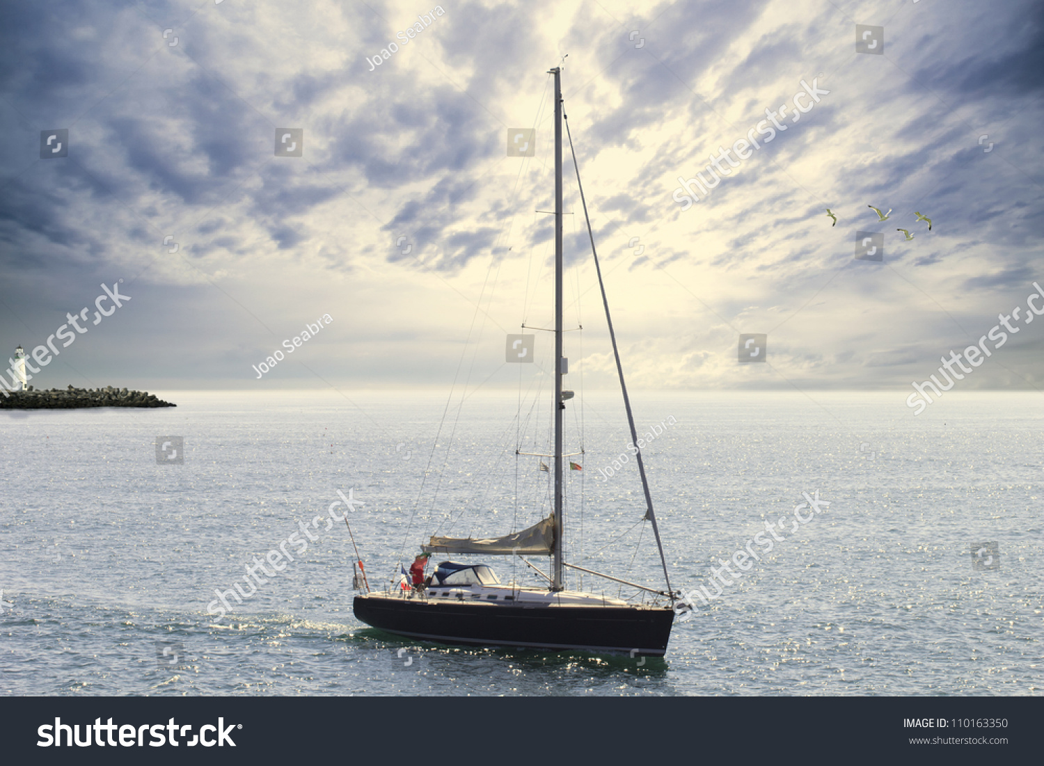 Blue Sailboat Leaving The Harbor Stock Photo 110163350 : Shutterstock