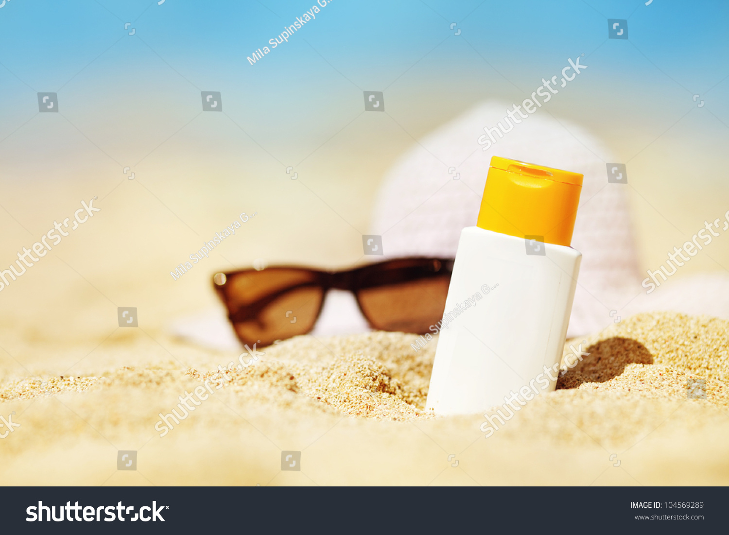 Bottle Of Sunscreen Lotion On The Sandy Beach Stock Photo 104569289 ...