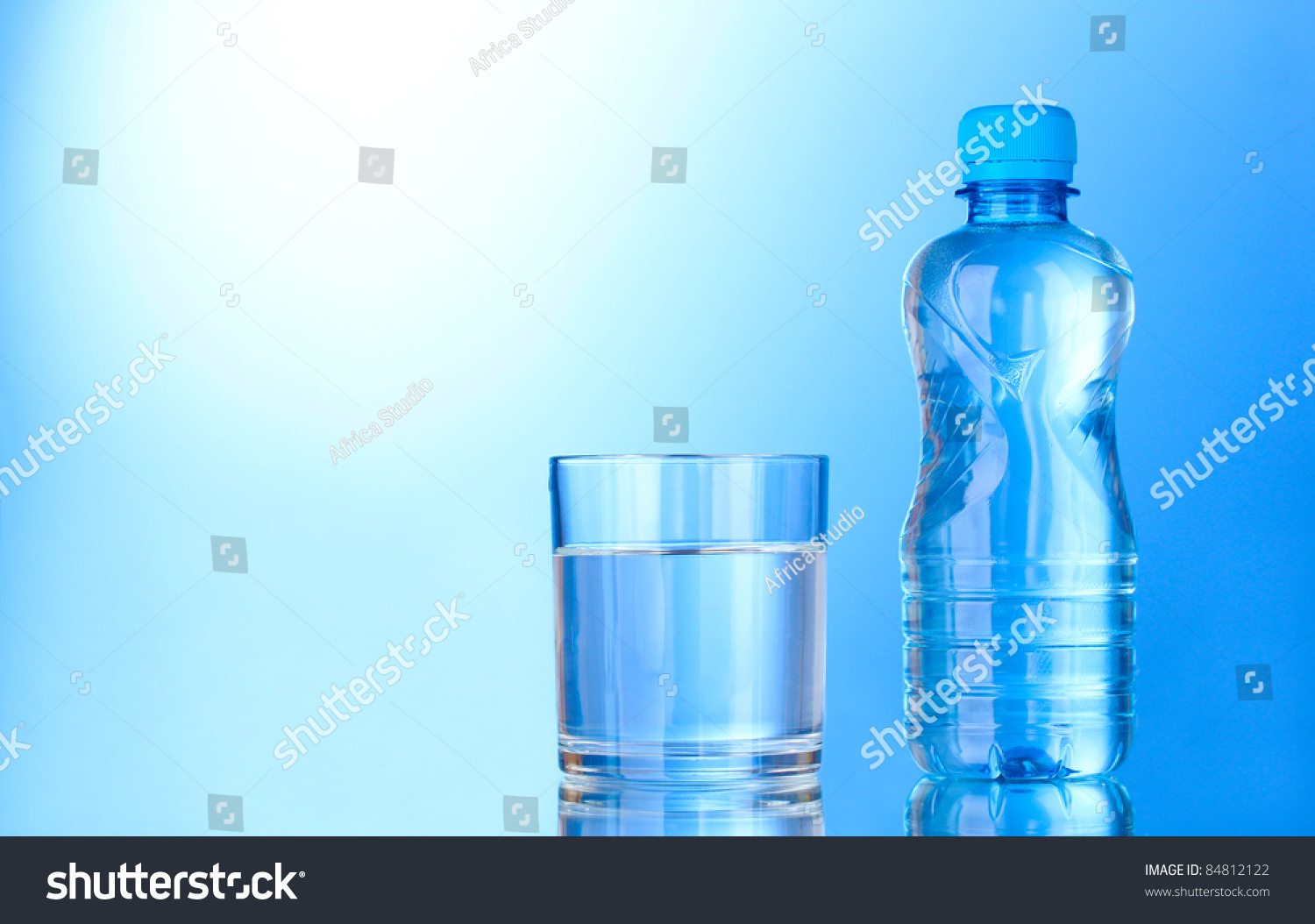 Bottle Water Glass On Blue Background Stock Photo (Edit Now) 84812122