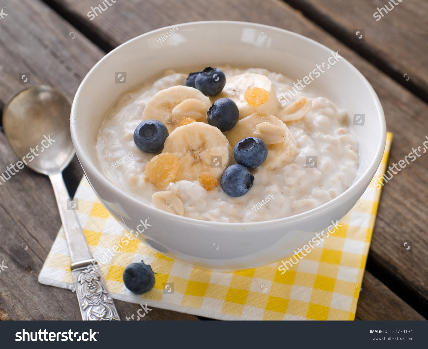 http://image.shutterstock.com/z/stock-photo-bowl-of-oatmeal-porridge-with-bananas-and-blueberry-selective-focus-127734134.jpg