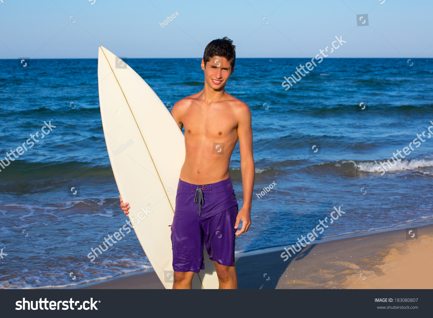Boy Teen Surfer Happy Holing Surfboard On The Beach Shore Stock Photo ...