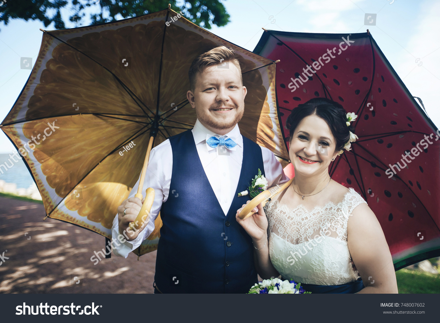 bride groom umbrellas